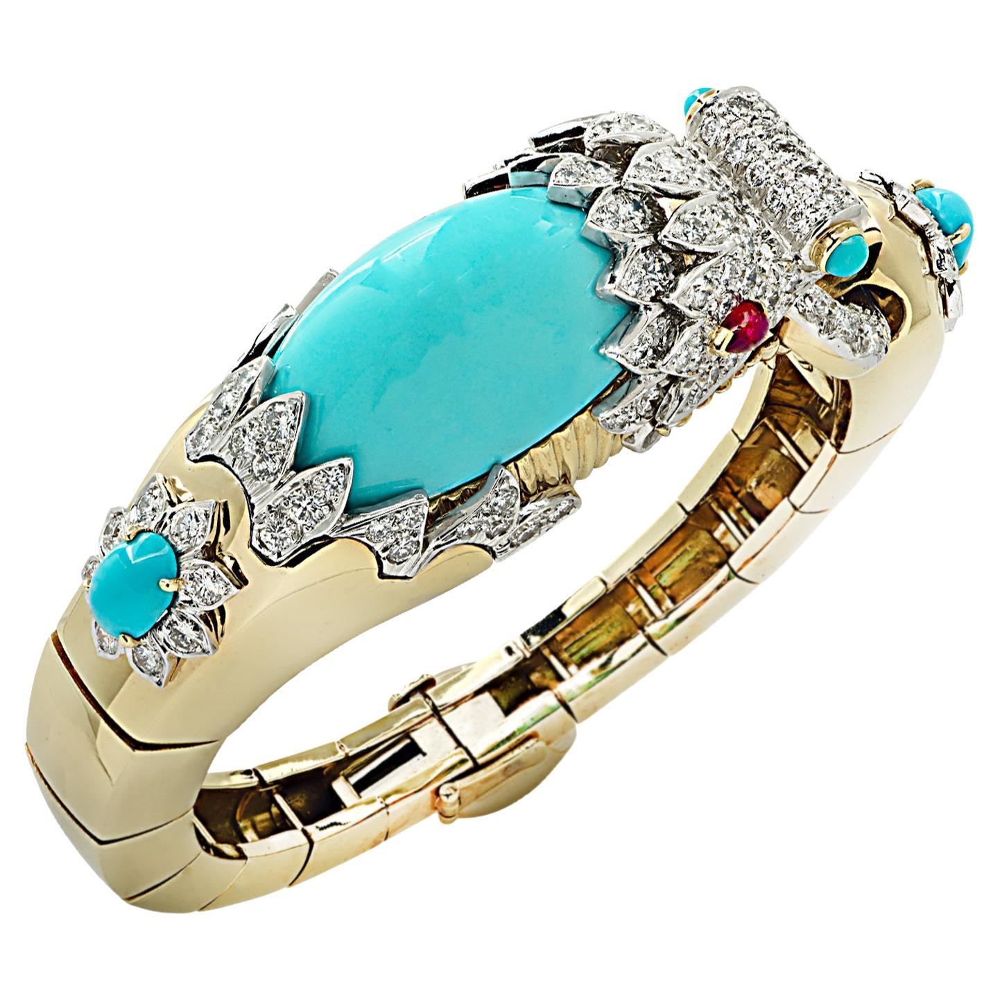 From David Webb’s iconic Kingdom collection, this exquisite Turquoise and Diamond Chimera bangle bracelet crafted in 18 karat yellow gold and platinum, with oval Turquoise cabochons, ruby eyes and 151 round brilliant cut diamonds weighing