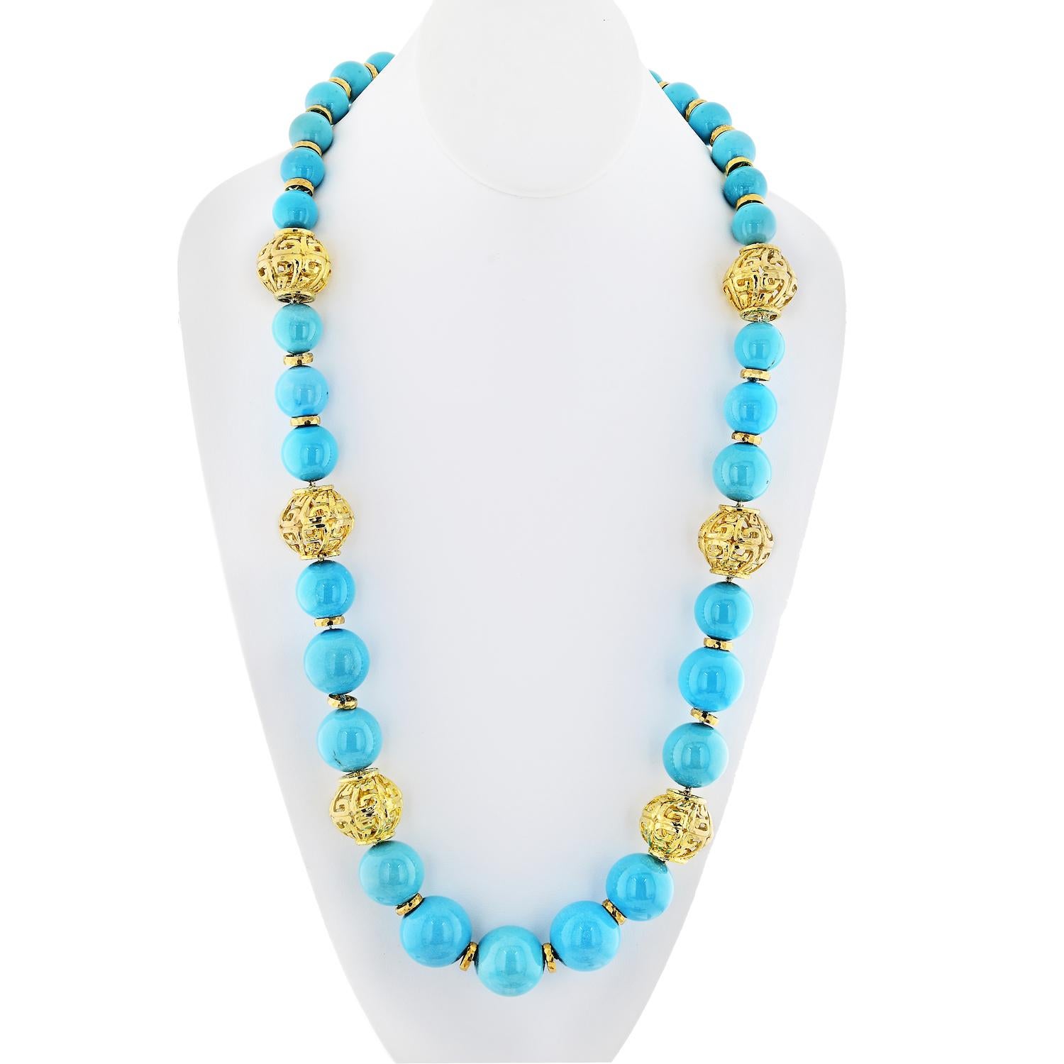 Indulge in the timeless elegance of a David Webb masterpiece with the remarkable 18K Yellow Gold Turquoise Bead Necklace, a true embodiment of luxury from the 1980s era. This exquisite necklace boasts a captivating strand of thirty-three turquoise