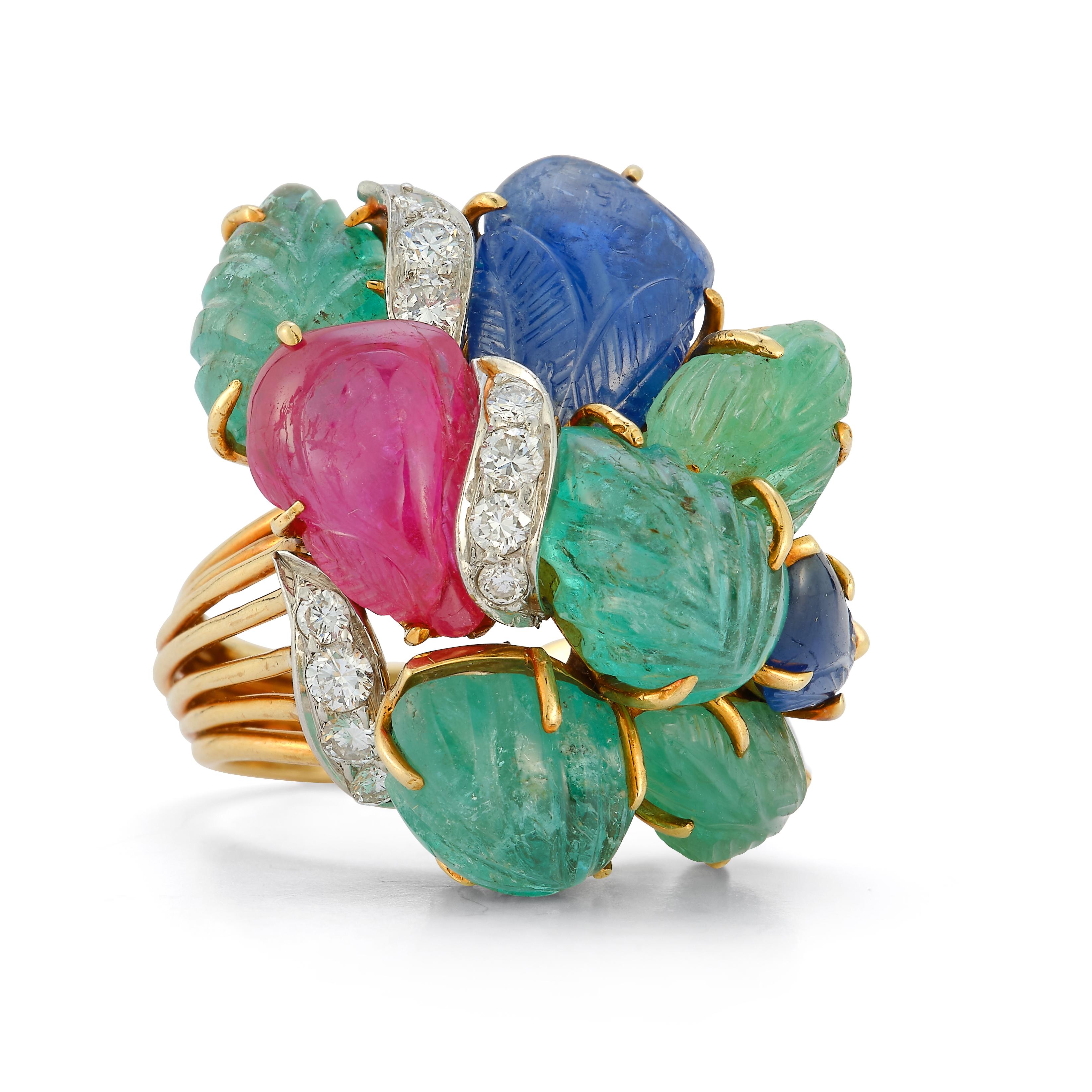 David Webb Tutti Frutti Ring 
 
An 18 karat gold ring set with carved emeralds, sapphires, & ruby, accented with 12 round cut diamonds

French import assay marks for platinum and 18 carat gold

Signed David Webb

Ring Size: 5.5
Re-sizable Free Of