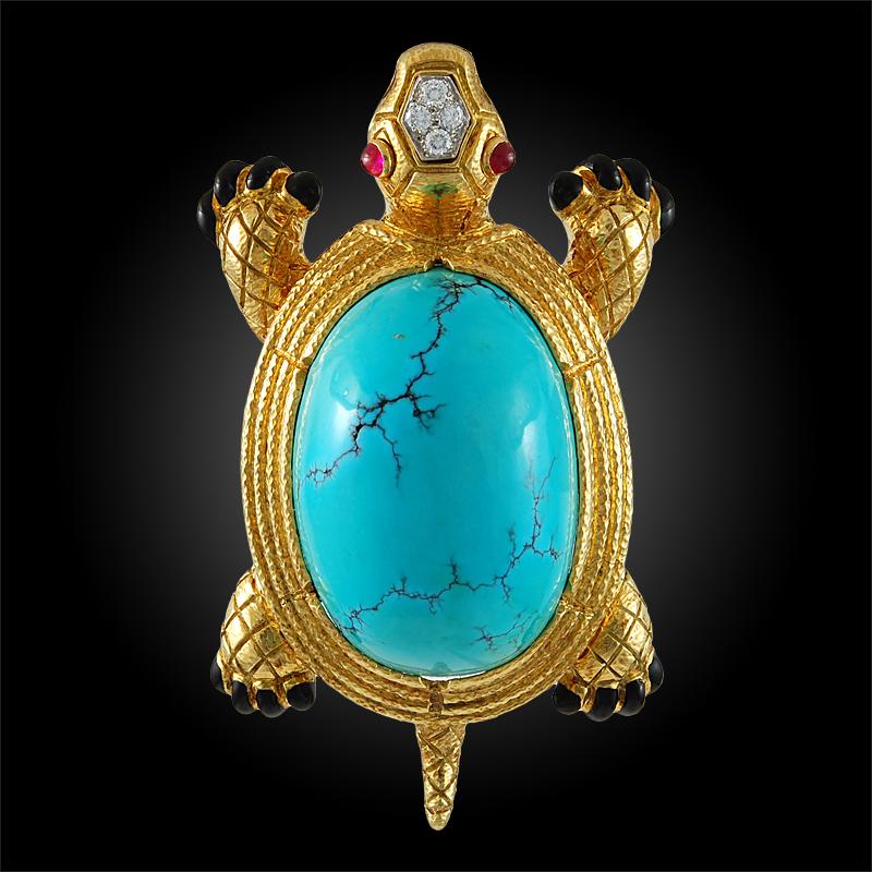 Part of the David Webb Kingdom Collection, this 18k and platinum turtle brooch is exquisitely accentuated by diamonds, cabochon turquoise, ruby and black enamel.

Signed David Webb
Circa 1970s