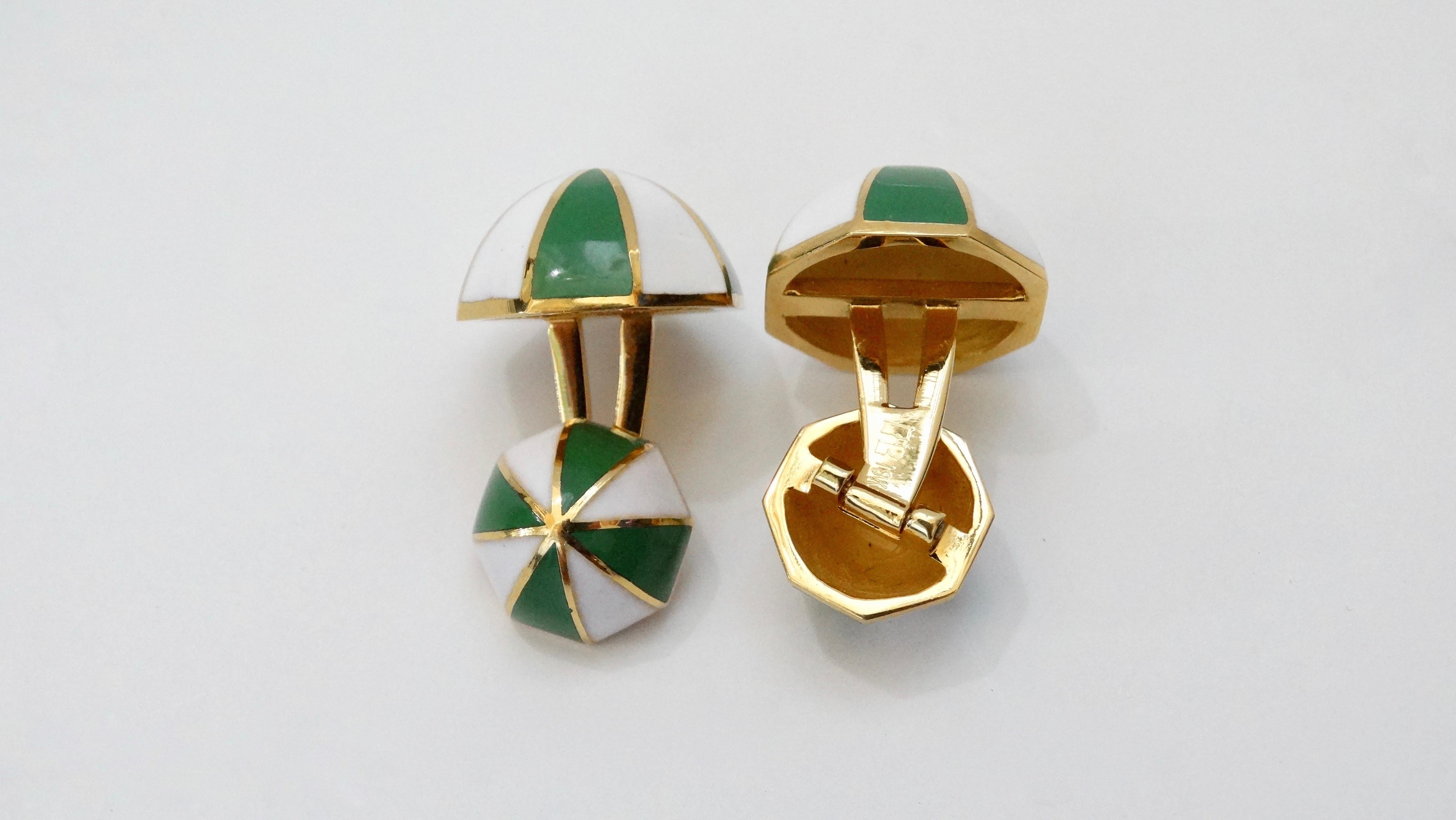 A great pair of statement cufflinks crafted by David Webb from 18k Gold. Features an octagon shape with a striped pattern made of white and green enamel. Stamped with an unknown initials and 18k. Total weight in grams is 24.34. 