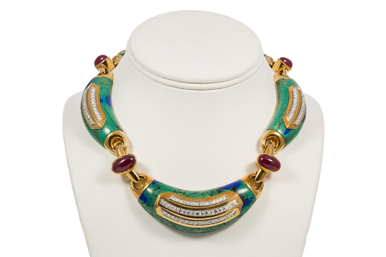 We are pleased to present this David Webb Vintage 18k Yellow Gold, Platinum, Azurite, Ruby & Diamond Jewelry Set. This set features a necklace, ring and earrings with an estimated 8.61ctw D-F/VVS-VS round brilliant cut diamonds accented with an