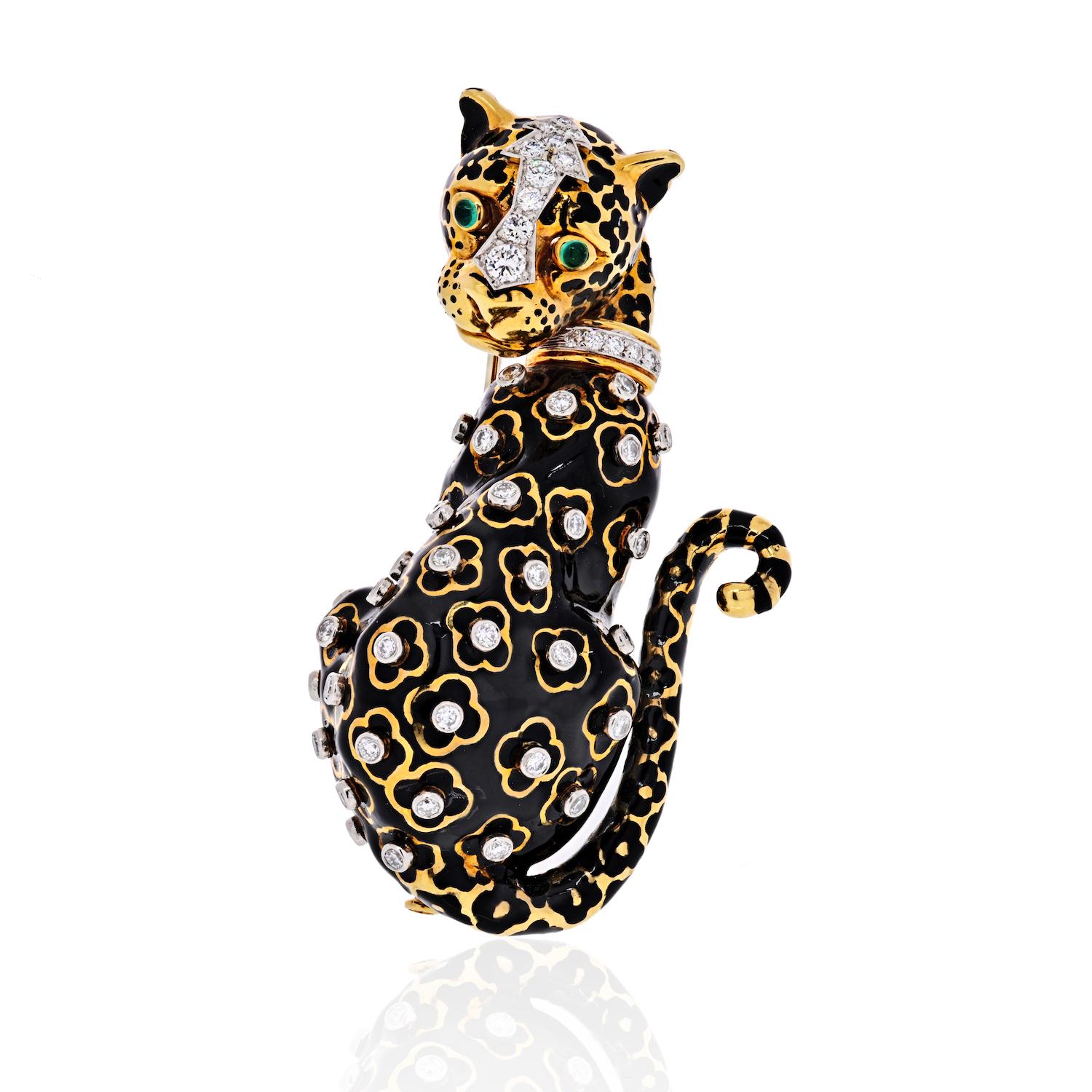 A Vintage David Webb leopard brooch designed in black enamel with gold spots enhanced with circular-cut diamonds, to the circular-cut diamond collar and cabochon emerald eyes, mounted in platinum and 18k yellow gold. Measurements: 2.5 inches long.