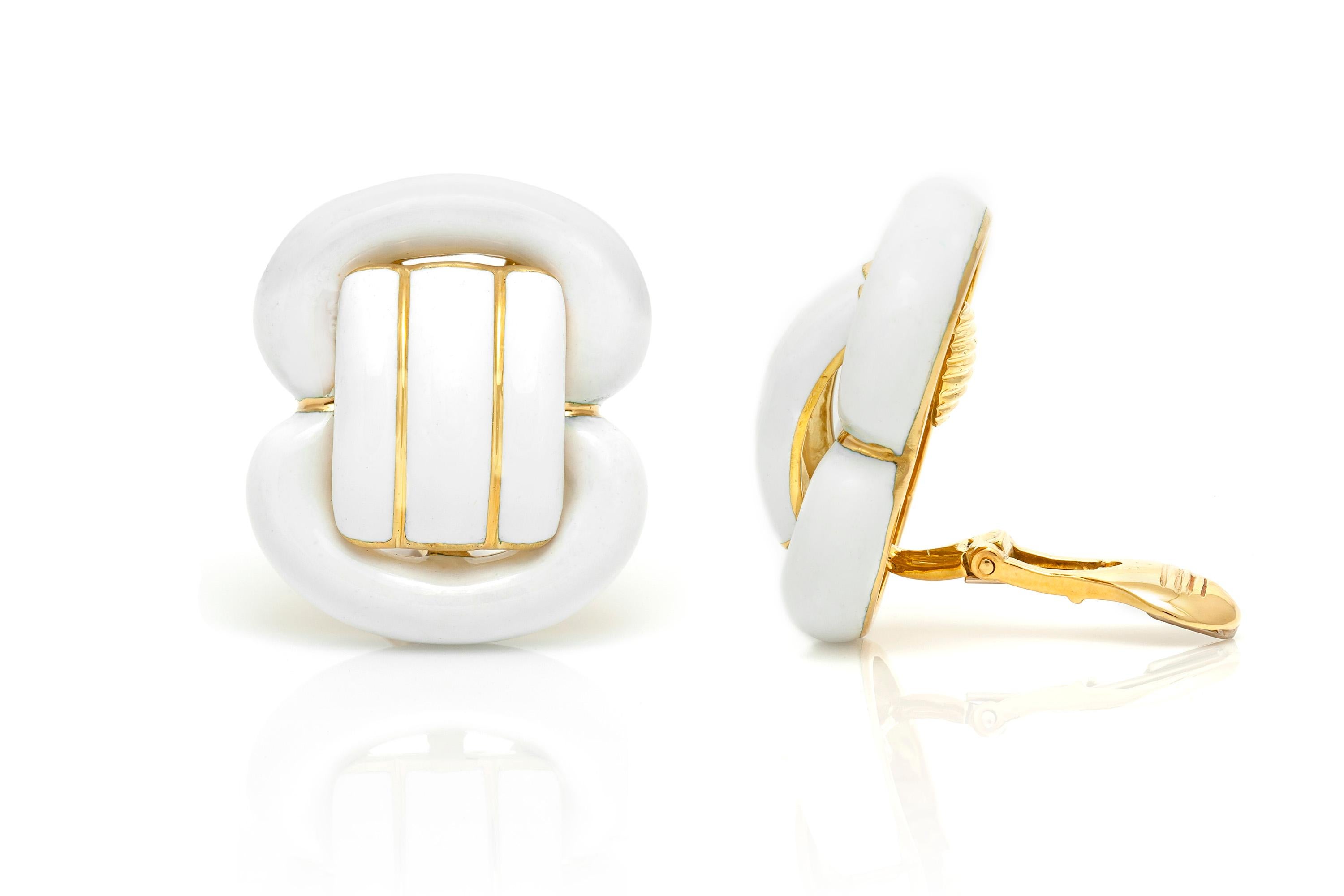 David Webb clip earrings ,finely crafted in 18 k yellow gold with white enamel.