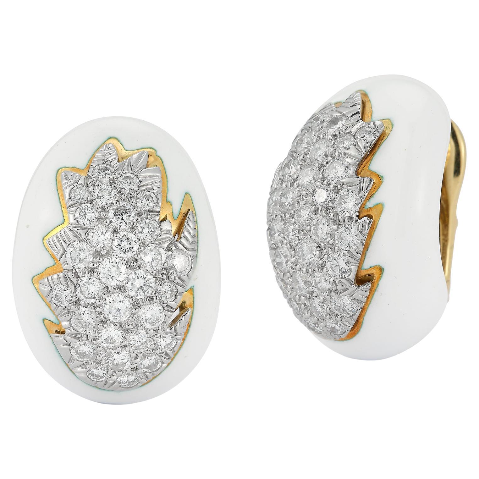 White Enamel and Diamond earrings by David Webb 

A cluster of round cut diamond surrounded by white enamel set in 18k yellow gold & platinum.

Measurements: 1