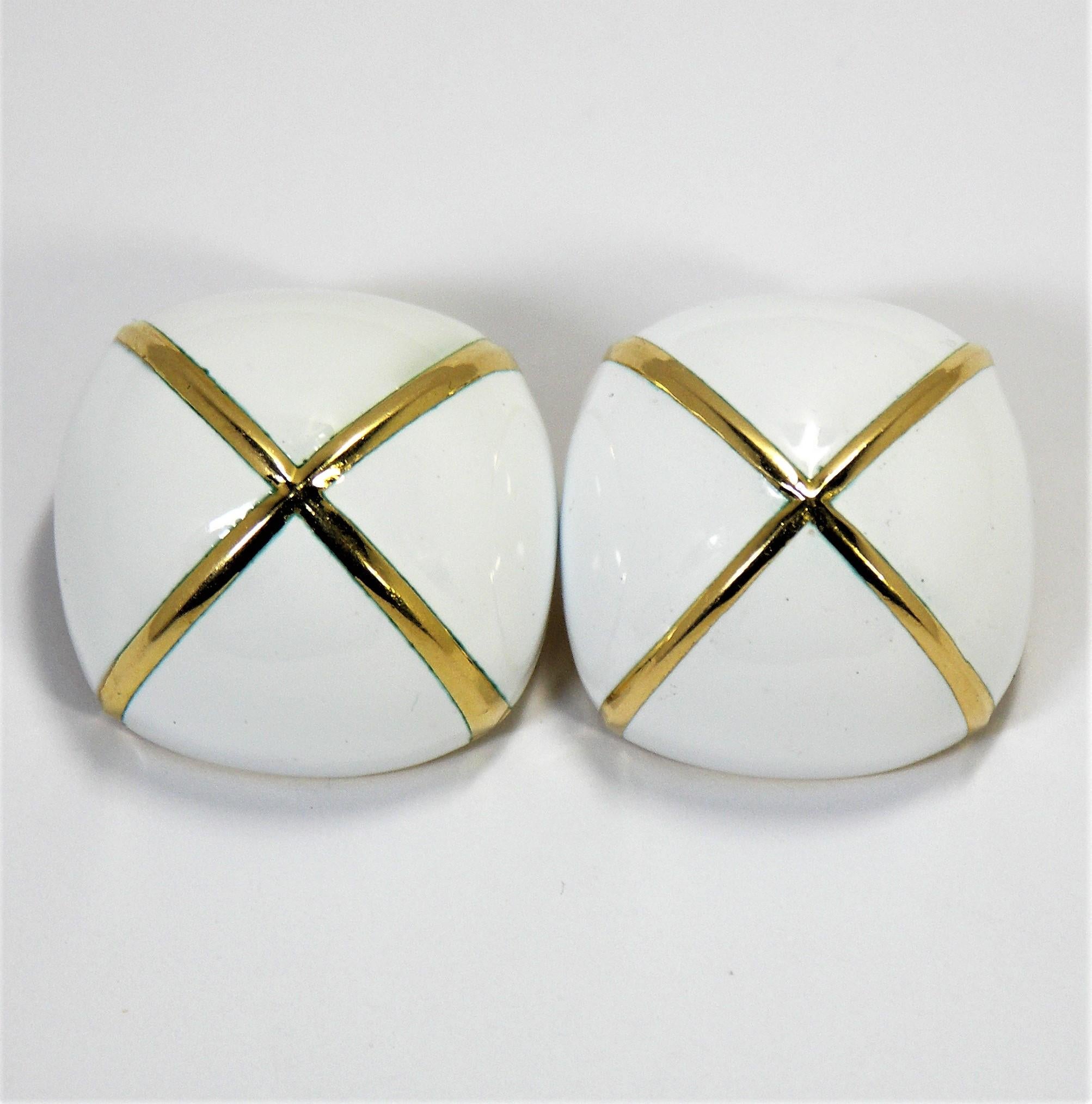 These large David Webb earrings are made of 18K Yellow Gold and white enamel 
with a large gold 