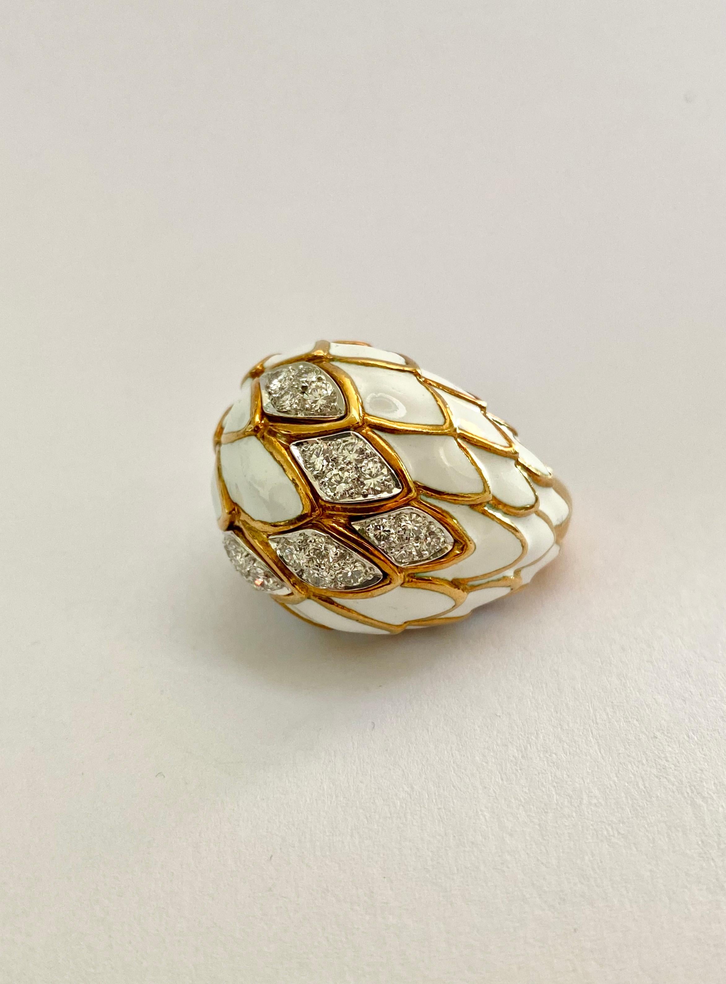 David Webb could be considered the king of enamel, and this fish scale design cocktail ring is a classic.  While many other jewelers have used enamel- mostly black- Webb jewelry represents the best use of white, which is much more complex to work