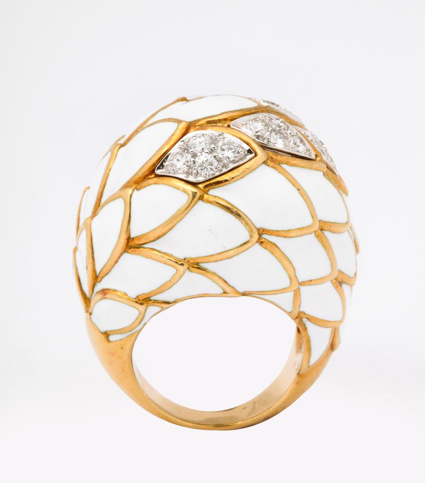 David Webb could is definitely the king of enamel, and this fish scale design cocktail ring is a classic.  While many other jewelers have used enamel- mostly black- Webb jewelry represents the best use of white, which is much more complex to work