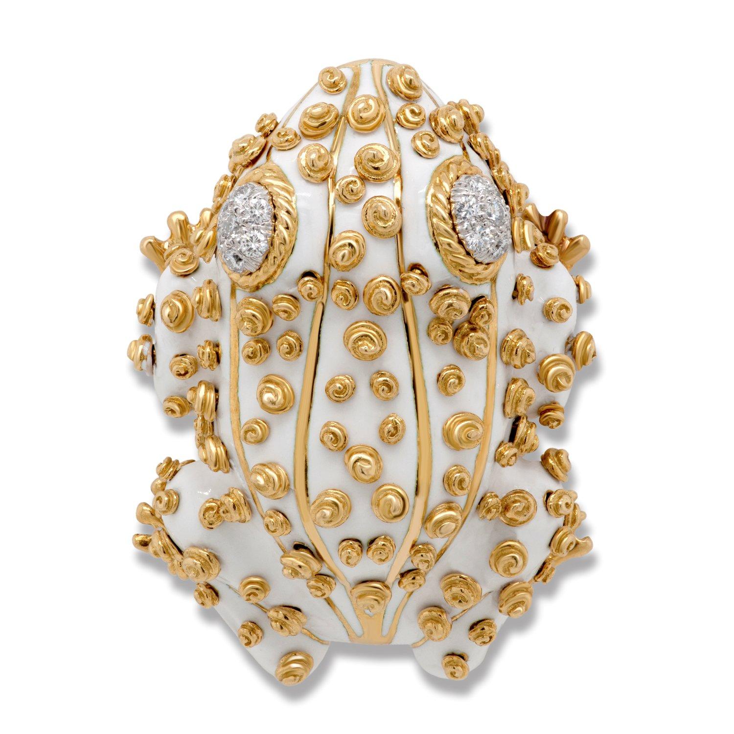 This iconic whimsical David Webb brooch set features two vintage white enamel frogs with diamond eyes set in 18k yellow gold, each accompanied by a David Webb certificate of authenticity.

The larger frog features 14 round brilliant cut diamonds