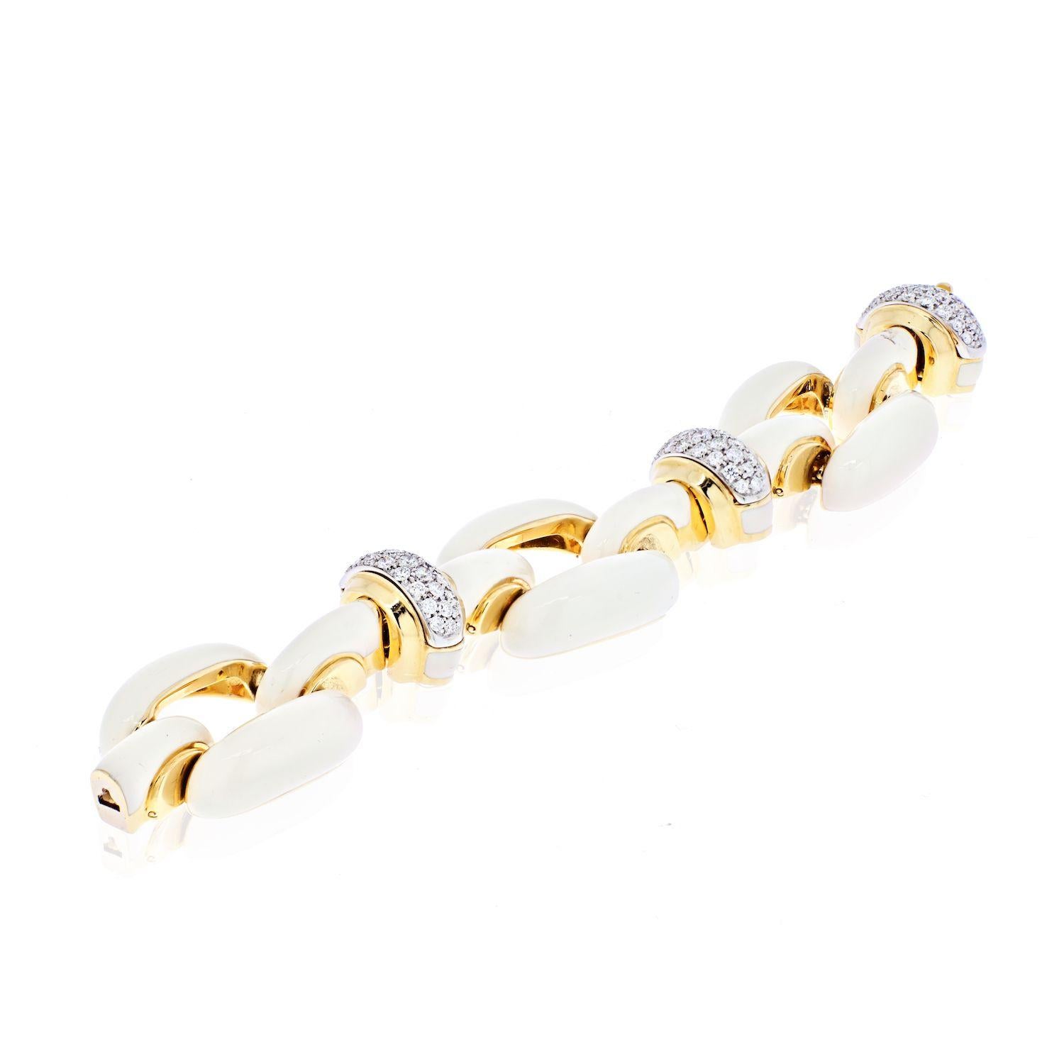 Circa 1975, chucky link bracelet by David Webb is so timelessly designed that it looks perfectly current and stylishly modern. Classic yet very fashion forward, the oversized 18K yellow gold links are enameled in a bright white and intersected with
