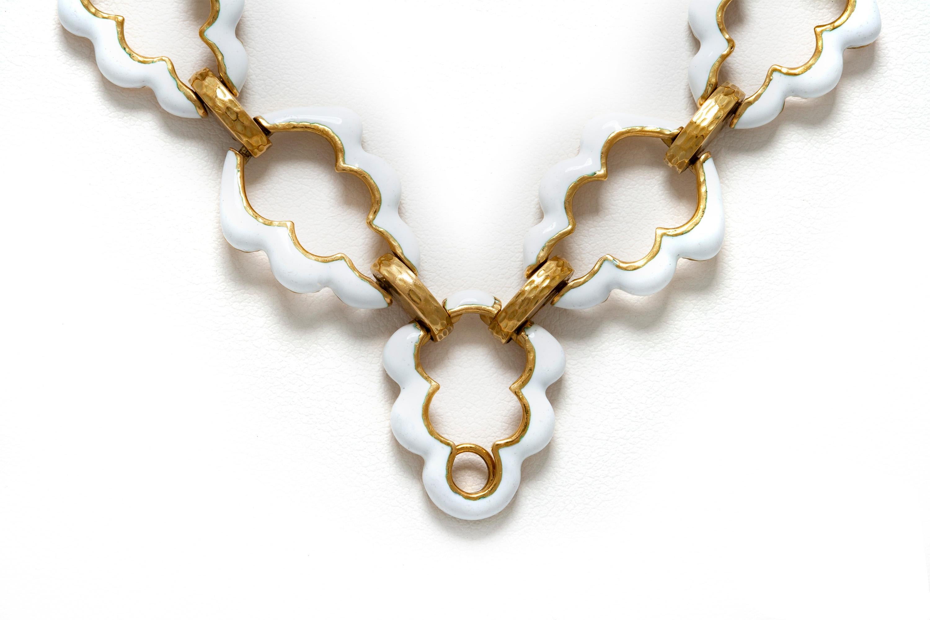 David webb white enamel long necklace finely crafted in 18k yellow gold composed with open work fancy -shaped with white enamel.
