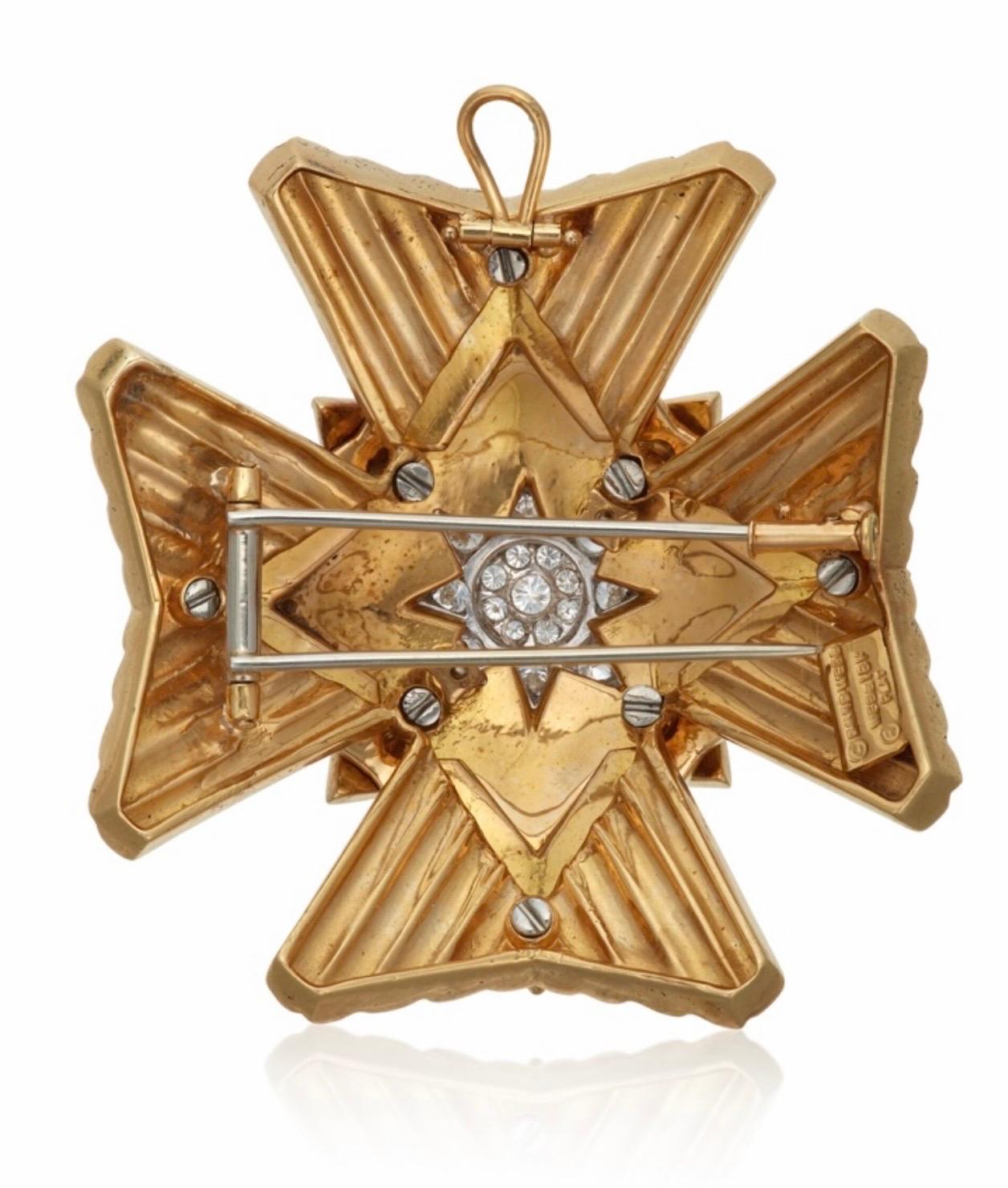 What an incredible addition to any jewelry collection. This classic David Webb enamel Maltese Cross Brooch that can also we worn as a pendant because if of the collapsible pendant hoop. This pieces has been created from 18kt yellow gold, platinum