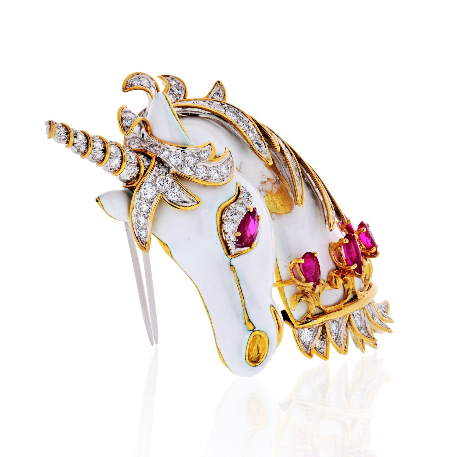 Designed as a unicorn, the eye and collar set with pear-shaped rubies, highlighted with round and single-cut diamonds, and applied with white enamel, signed Webb. The rubies are medium to medium deep purplish red. The diamonds, estimated to weigh a