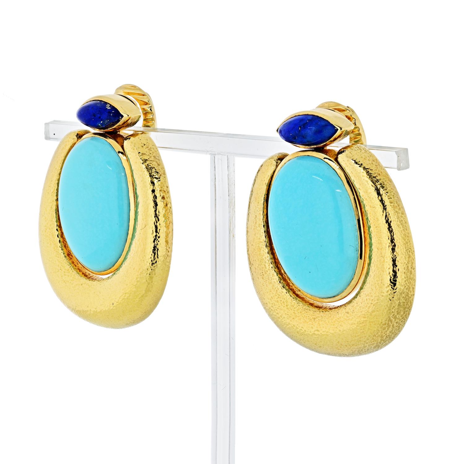 David Webb 18K Oval cabochon turquoise, marquise cabochon lapis lazuli, and hammered finish. This is a clip on earring for non-pierced ears.

MATERIAL: 18K Yellow Gold
DIMENSIONS: 41mm long x 33mm wide
GRAMS: 56gr
CONDITION: Excellent
