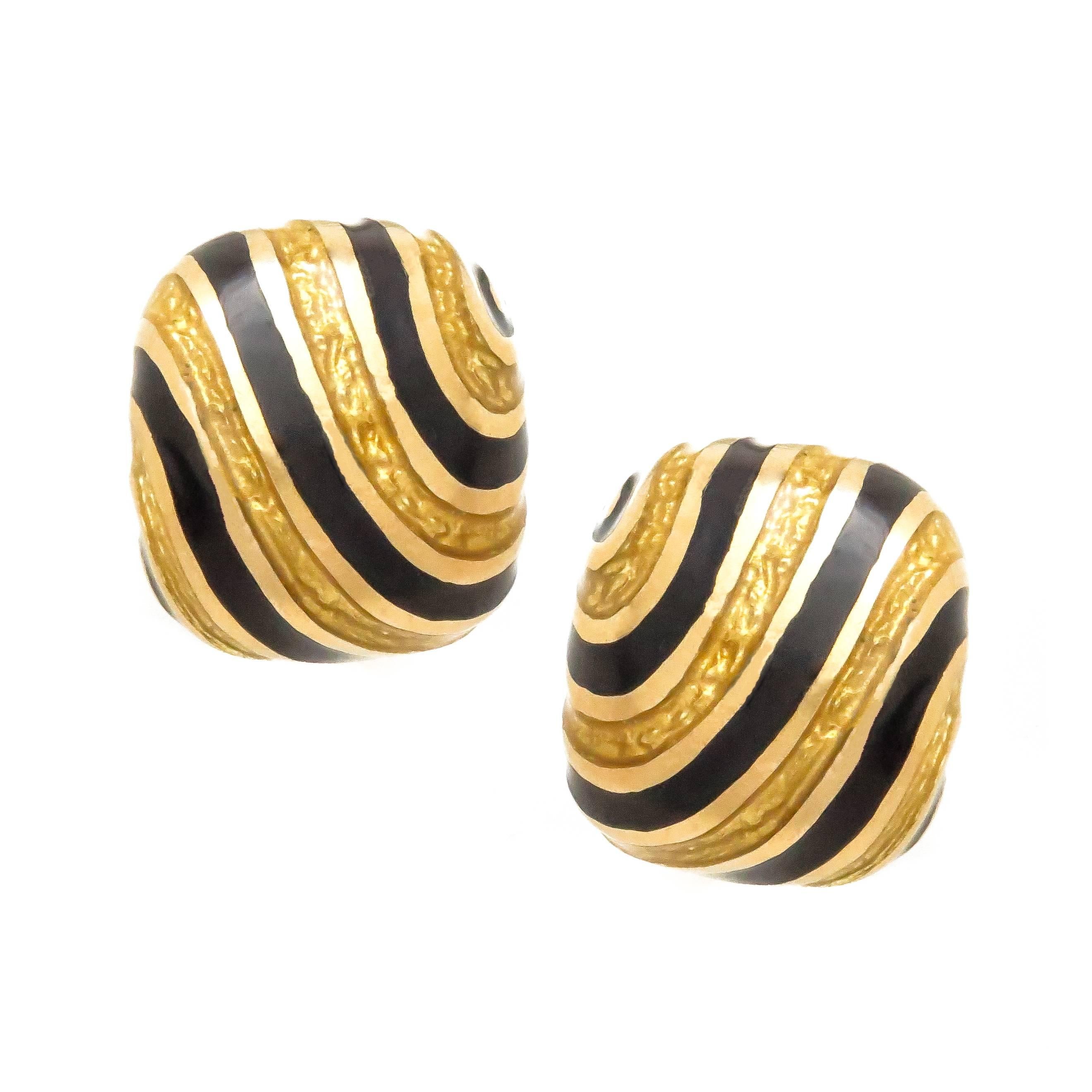 Circa 1970s David Webb 18K Yellow Gold Cufflinks. The cushion shape tops measure 5/8 X 5/8 inch. Finished in Black and Yellow Enamel and having Toggle backs for easy on and off. 