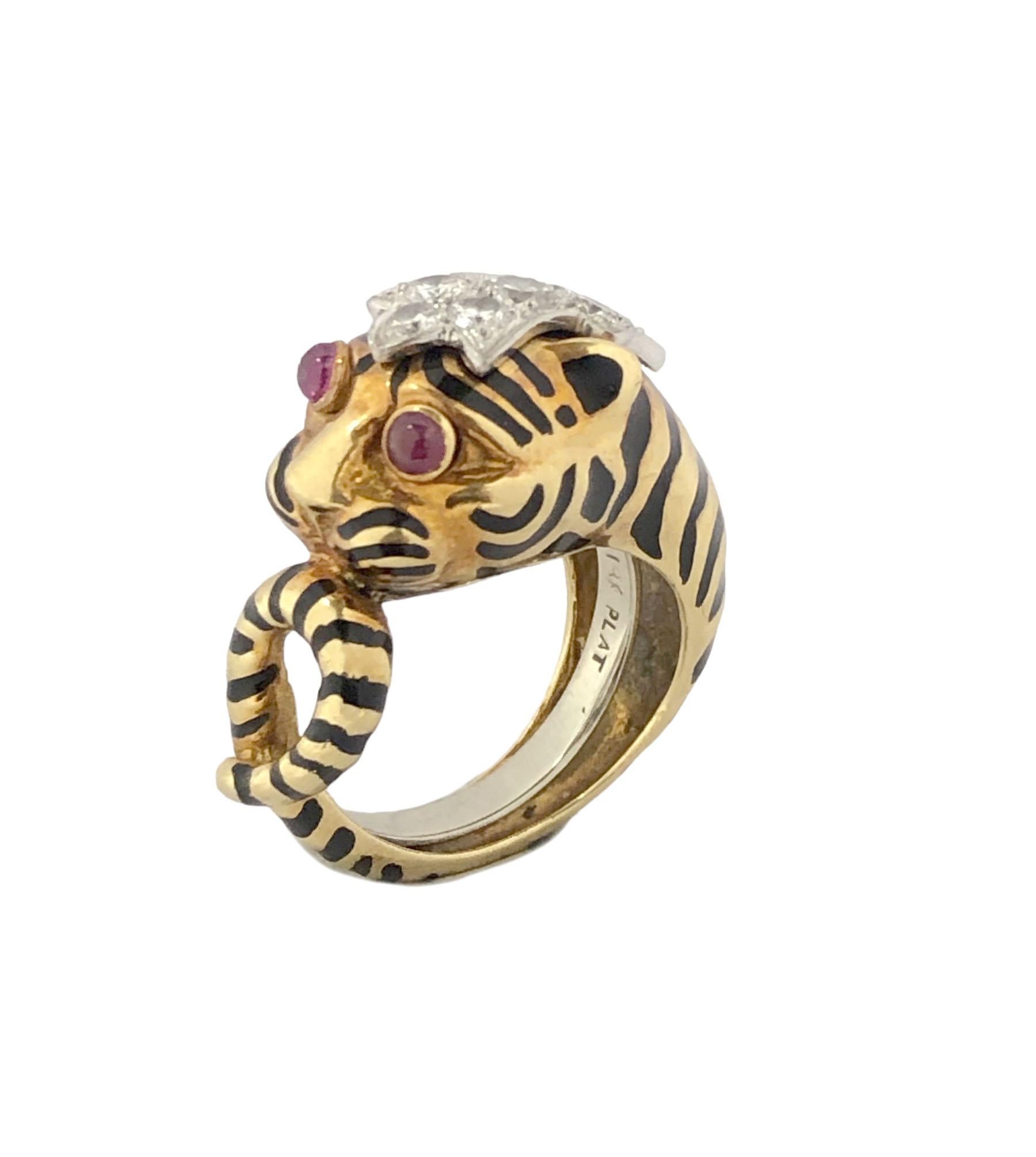 Circa 2000 David Webb 18k Yellow Gold and Platinum Tiger Ring, the top of the ring measures 7/8 x 1/2 inch, the top is set with numerous Round Brilliant cut Diamonds totaling approximately .40 Carat, Cabochon Ruby Eyes and iconic David Webb Detailed