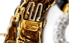 David Webb Yellow Gold Black Enamel Two-Lion Heads Emerald Kingdom Bracelet