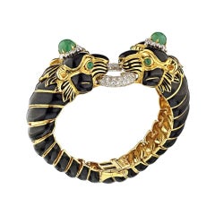 David Webb Yellow Gold Black Enamel Two-Lion Heads Emerald Kingdom Bracelet