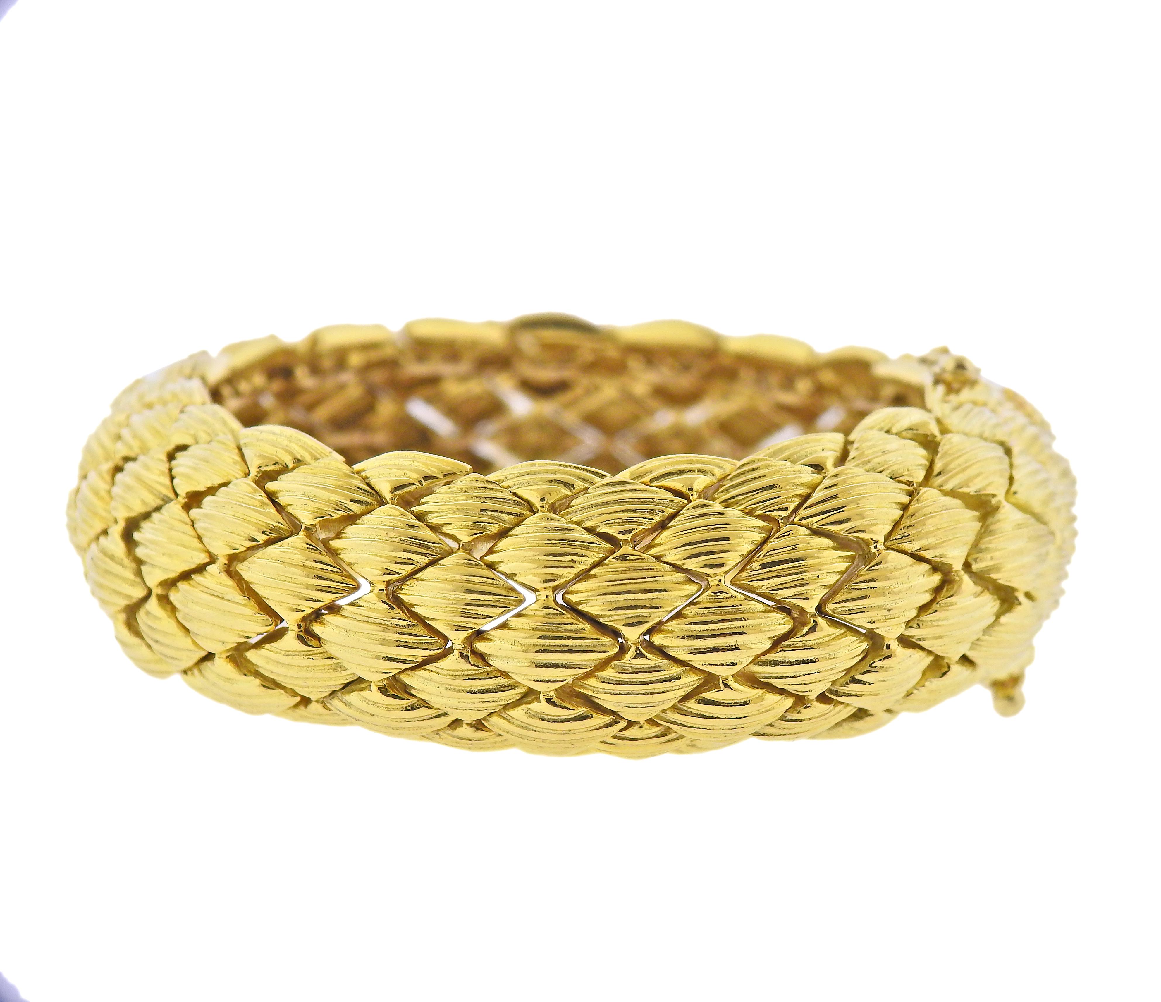 18k yellow gold bracelet by David Webb. Bracelet will fit comfortably up to a 7