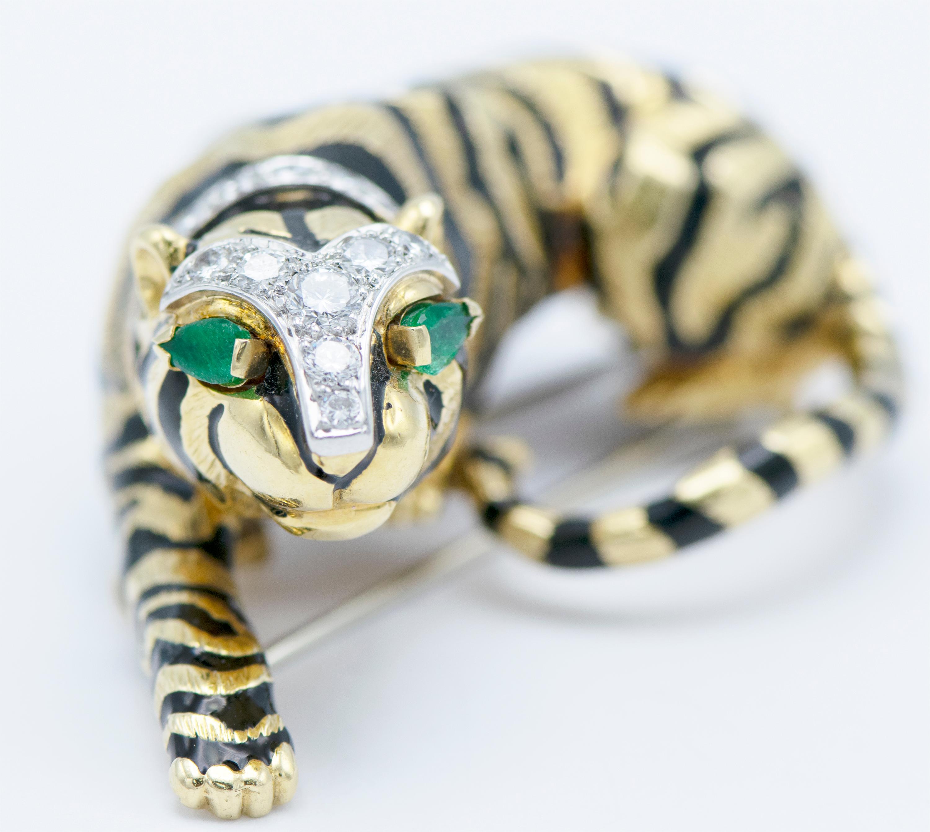 18KYG Crouching Tiger with black enamel stripes with two pear-shaped emerald eyes approximately 1.25 carats and 25 brilliant-cut diamond approximately 1.25 carats. Estimated total weight is 53.6 grams. Signed by David Webb.