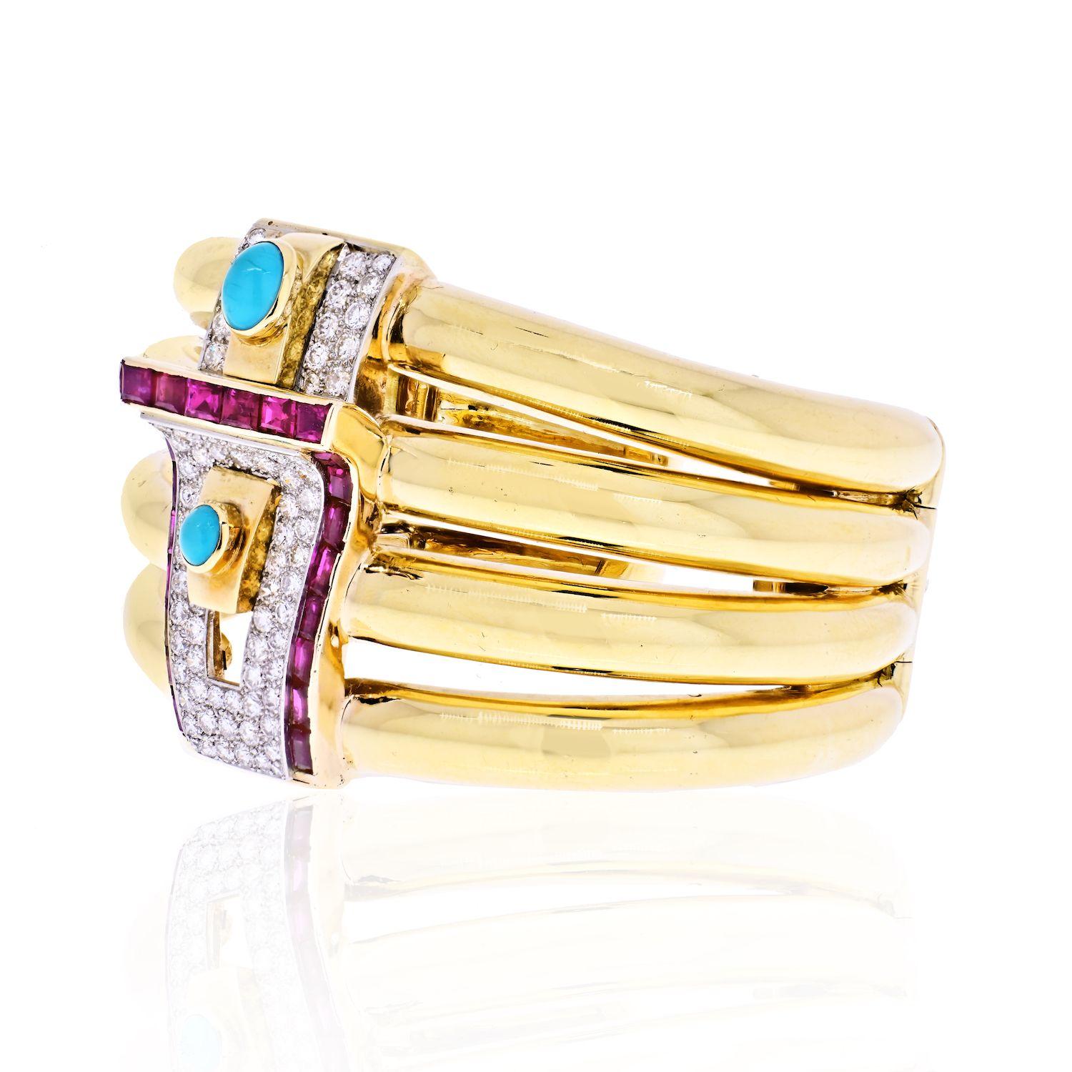 The cuff features full-cut diamonds weighing a total of approximately 3.15 carats, enhanced by baguette-cut rubies weighing a total of approximately 2.35 carats, complemented by oval-shaped turquoise cabochons, set in 18k gold, having platinum