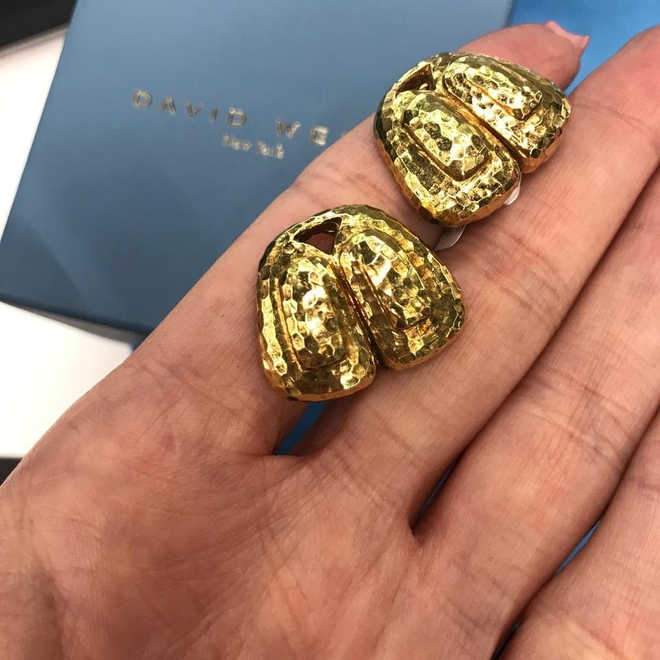 1970's Vintage Genuine David Webb Ladies 18K Yellow Gold Hammered Clip-On Earrings

DESCRIPTION:
A pair of 18K yellow gold earrings by David Webb, featuring an ancient inspired design, beautifully hammer finished for a rich appearance. These finely