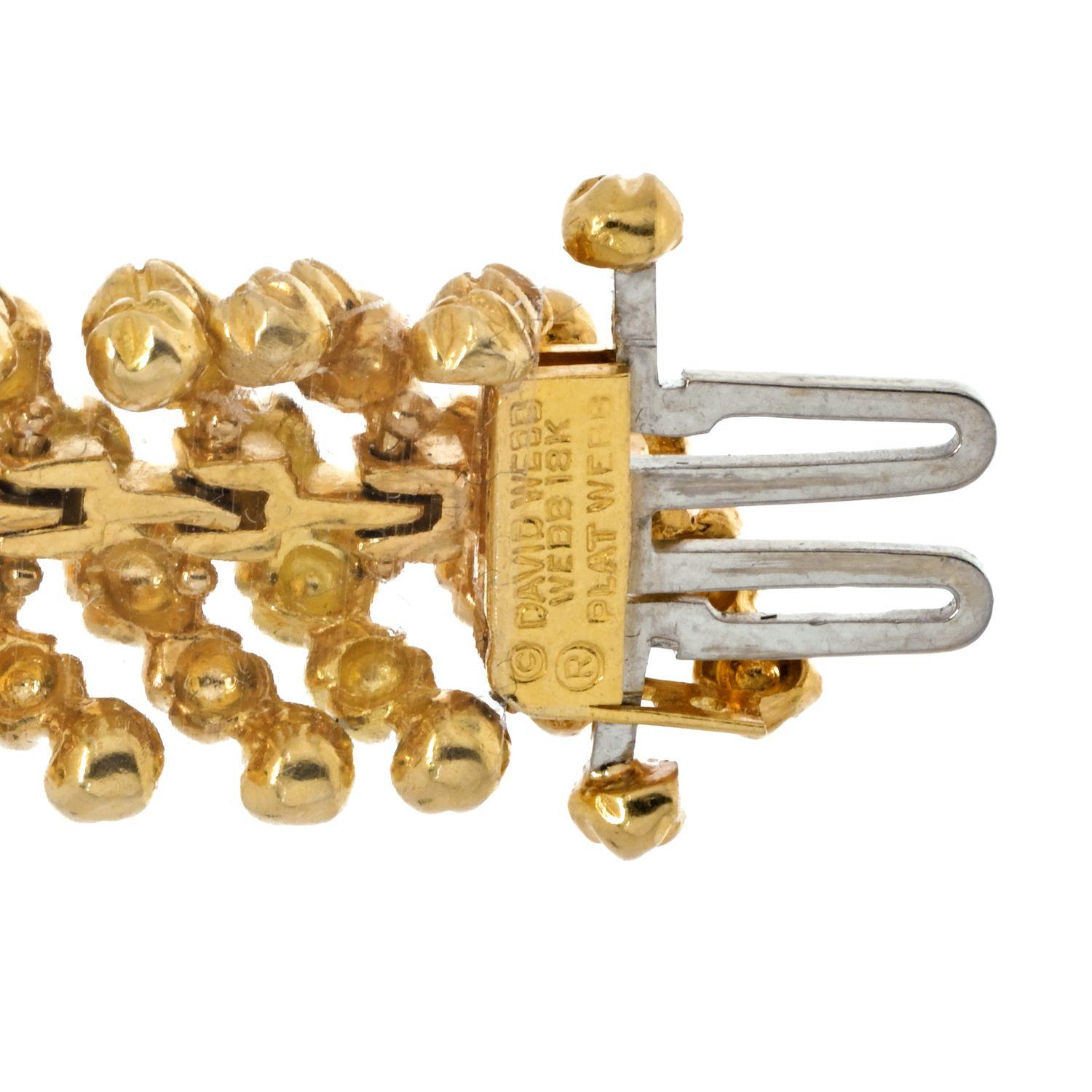 Exclusively from our David Webb estate collection, comes a brilliant and textured bracelet. David Webb is the quintessential American jeweler of exceedingly modern jewelry. The bracelet is 18K yellow gold and platinum with scalloped links and