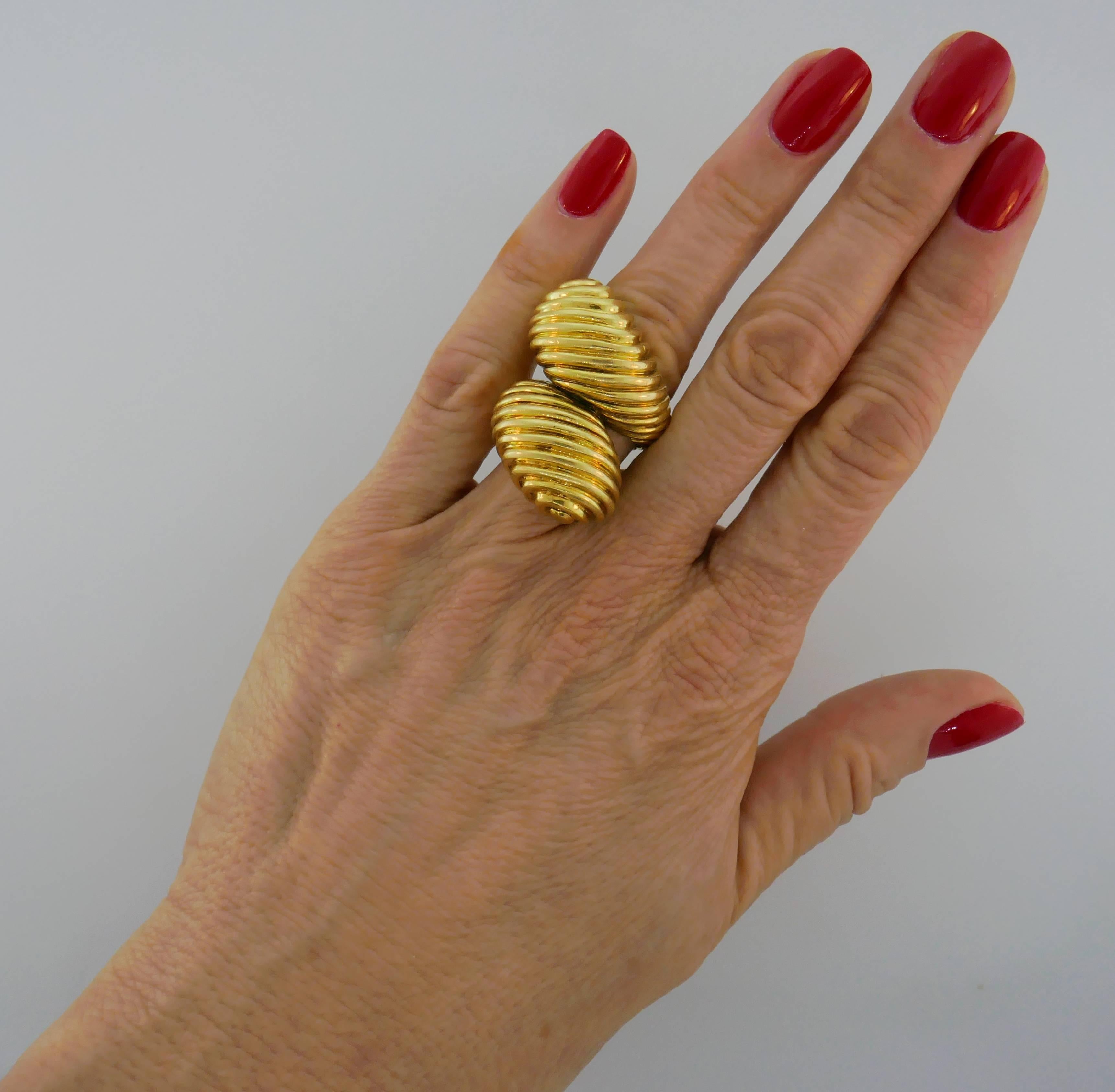 Bold cocktail ring created by David Webb in the 1970s. It is made of 18 karat yellow gold and designed as a stylized snake. Sharp, chic, prominent and wearable, the ring is a great addition to your jewelry collection.
The ring is size 5.5-6. It is