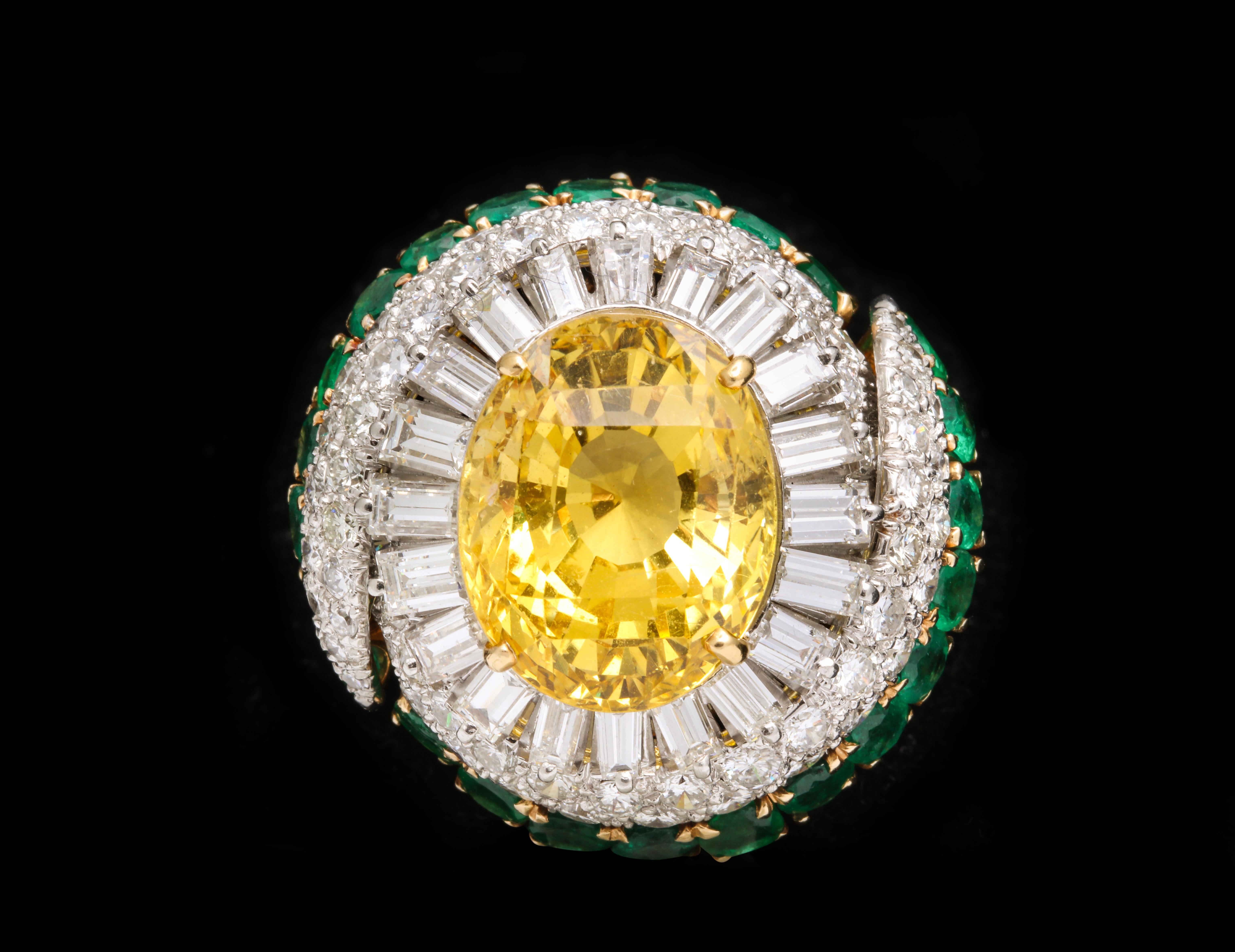 Incredible cocktail ring set yellow sapphire weighing approx 22 carats

Set with mix cut diamonds and emeralds

Made by David Webb circa 1970