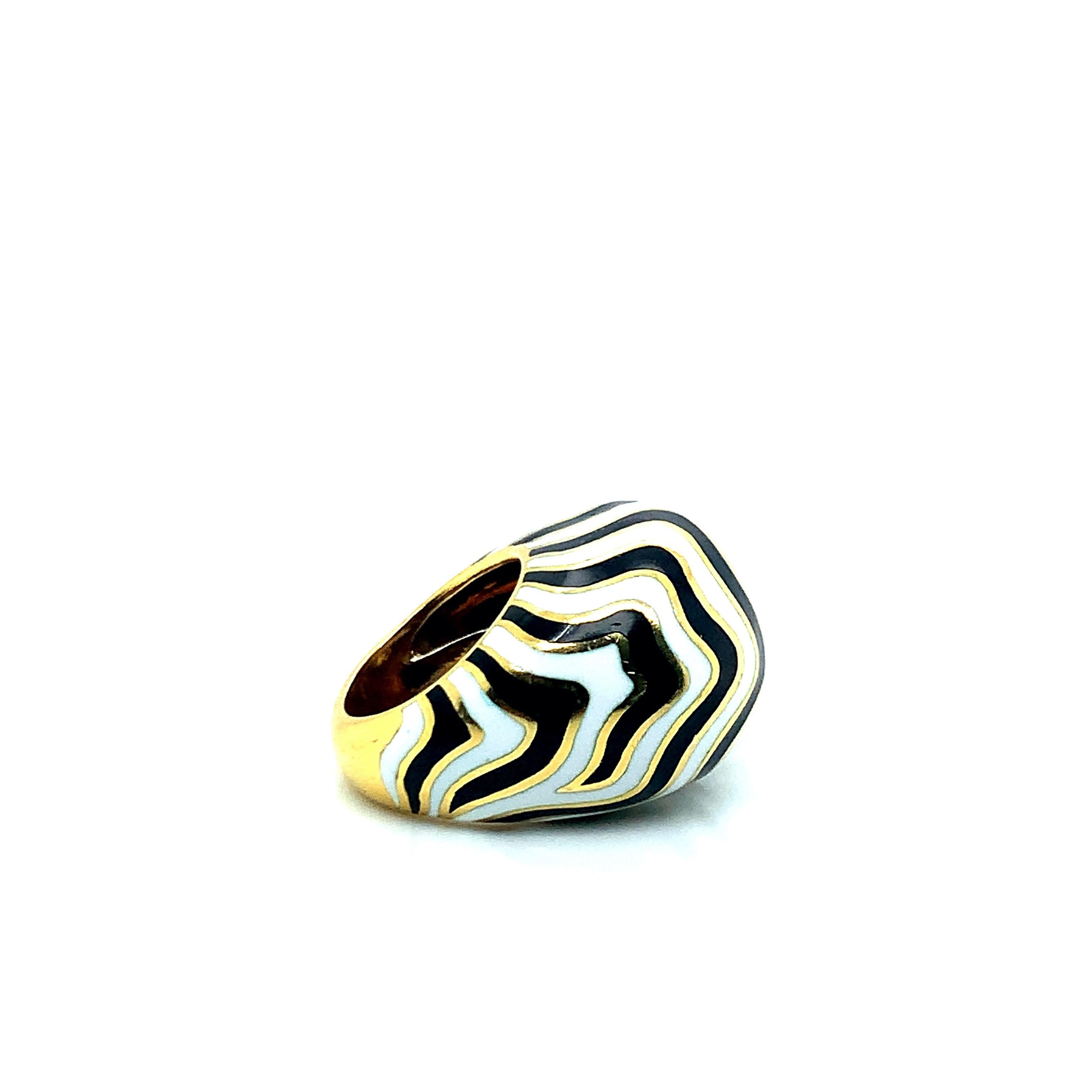 From David Webb's Zebra collection, this ring features the famous African animal's black and white stripe print. Set on 18 karat yellow gold, this ring weighs 21.7 grams. Size 4.75.