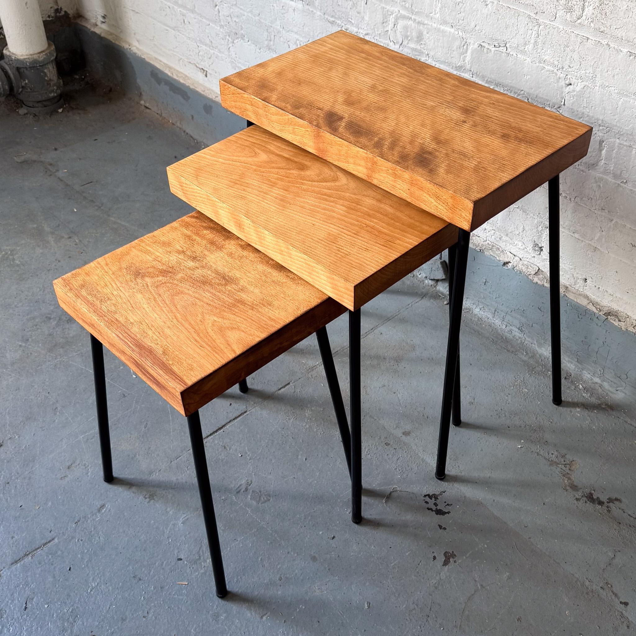 Nest of three tables with birch tops and blackened tubular steel legs. Designed by David Wurster and produced for Richards-Morgentau (Raymor) circa 1952. Wurster's lighting was a regular Good Design selection at MoMA in the early 1950's, and this