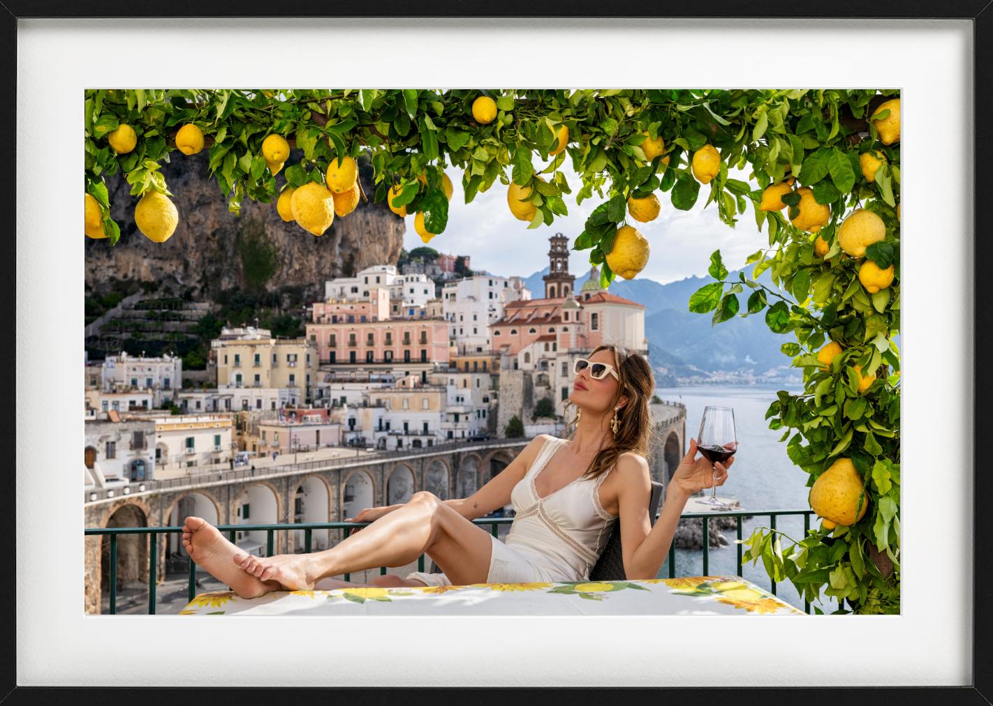 A woman sipping a glass of wine in Atrani, Italy, photographed by David Yarrow. Available in black and white and color.  

All prints are limited edition. Available in multiple sizes. High-end framing on request.

All prints are done and signed by