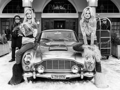 Badrutt's - b&w photograph of two models posing next to a car in St. Moritz 