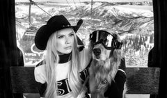 Gondola - model Josie Canseco with a dog wearing glasses in a ski gondola