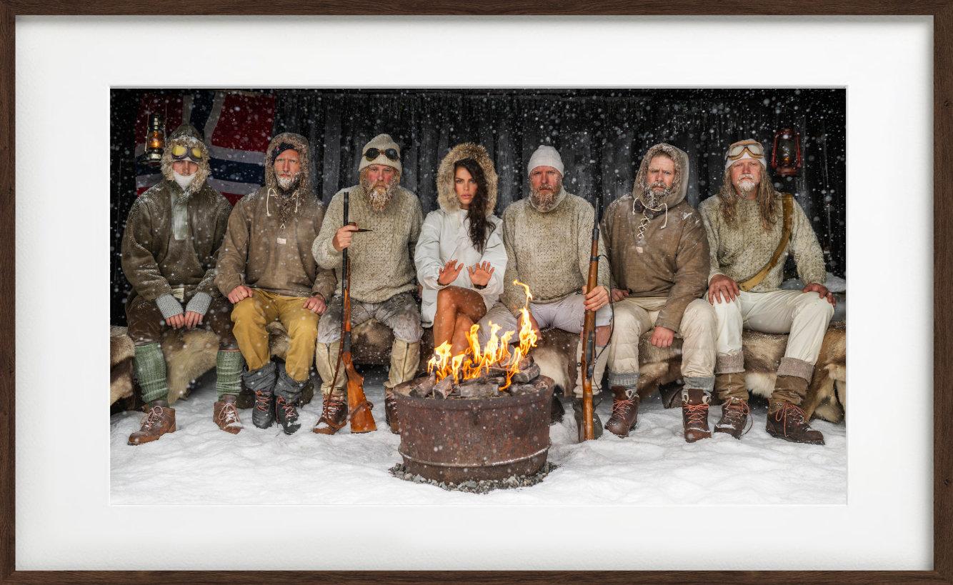 Ice Ice Baby - Brooks Nader with Polar Explorers Sitting Around Fireplace Colour - Photograph by David Yarrow