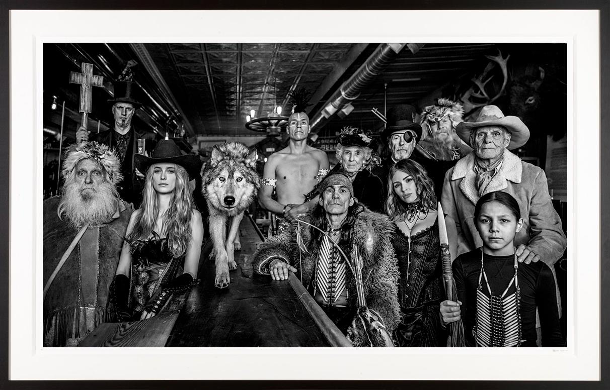 David Yarrow Black and White Photograph - "Last Chance Saloon" Supermodels & Locals at the Pioneer Bar
