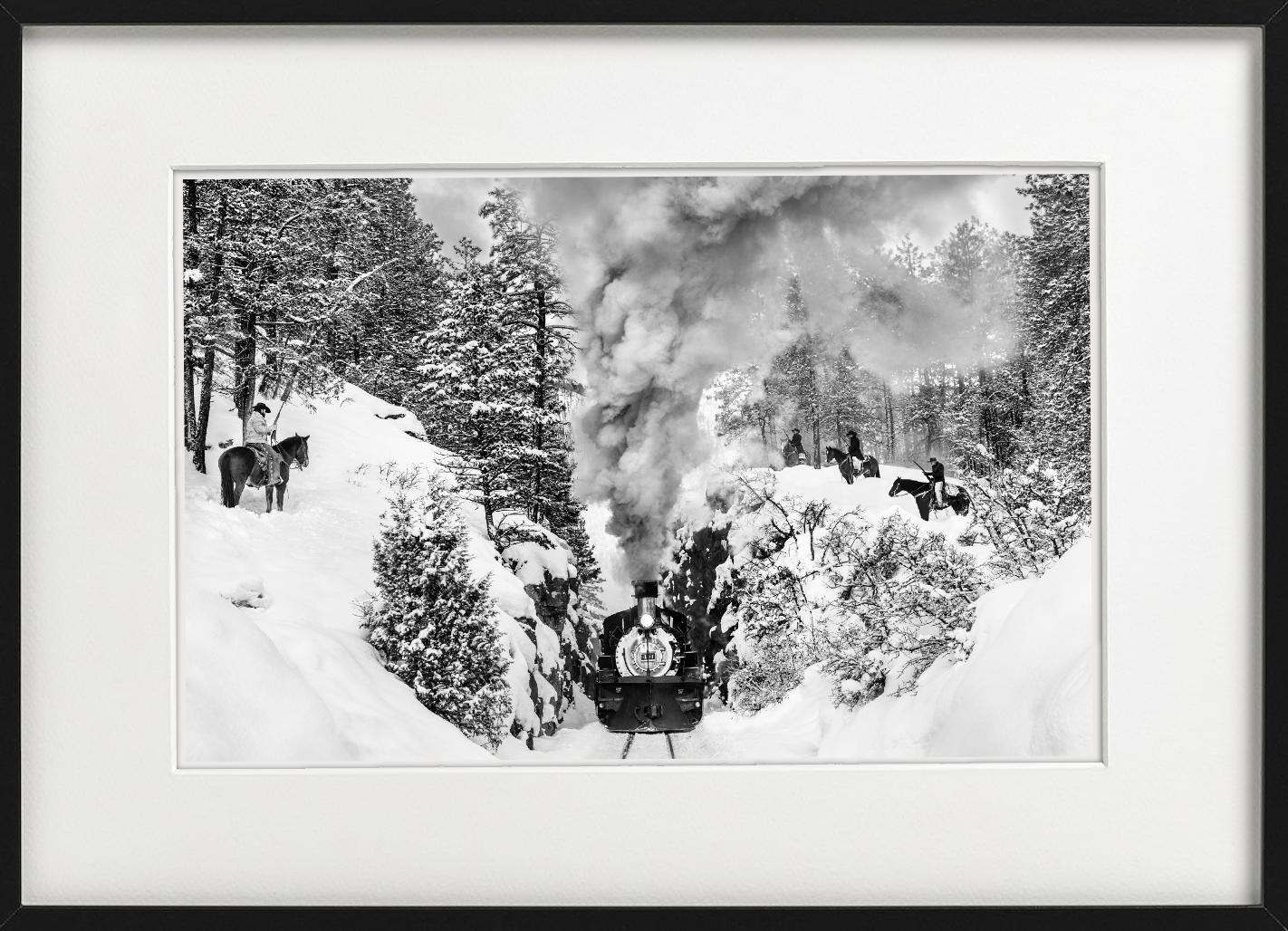 'Outlaws' - Cowboys ambushing historic train in snow, fine art photography, 2024 - Contemporary Photograph by David Yarrow