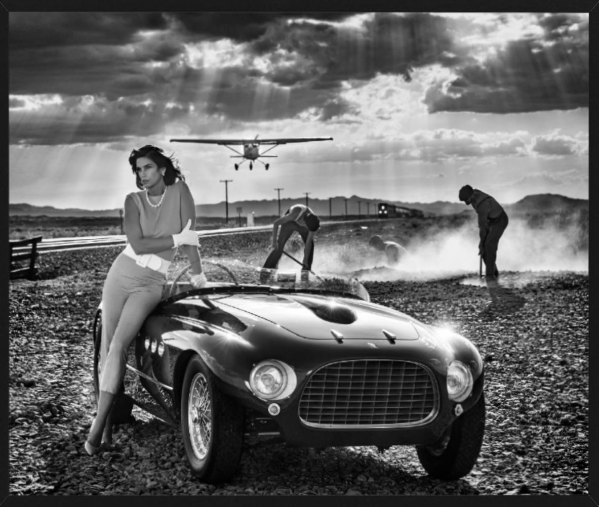 Planes, Trains and Automobiles - Supermodel Cindy Crawford with vintage Ferrari - Photograph by David Yarrow