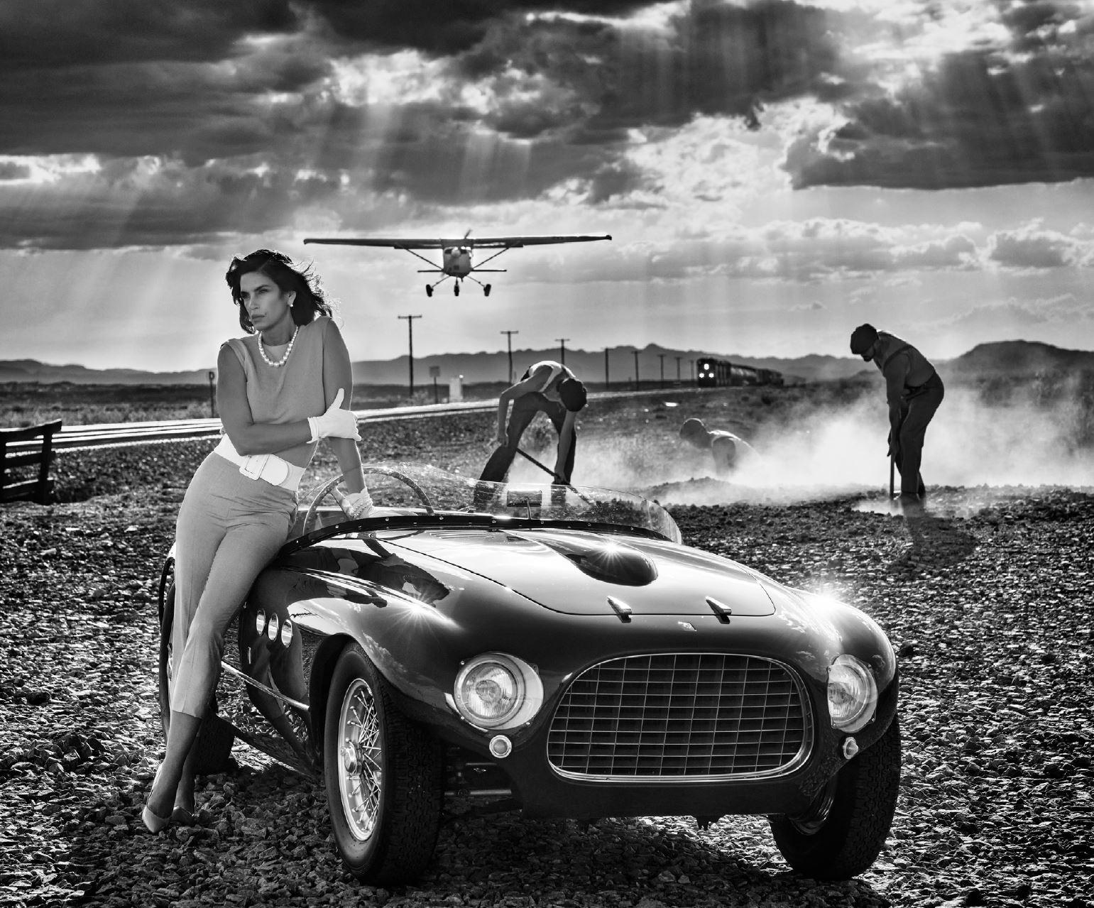 David Yarrow Figurative Photograph - Planes, Trains and Automobiles - Supermodel Cindy Crawford with vintage Ferrari