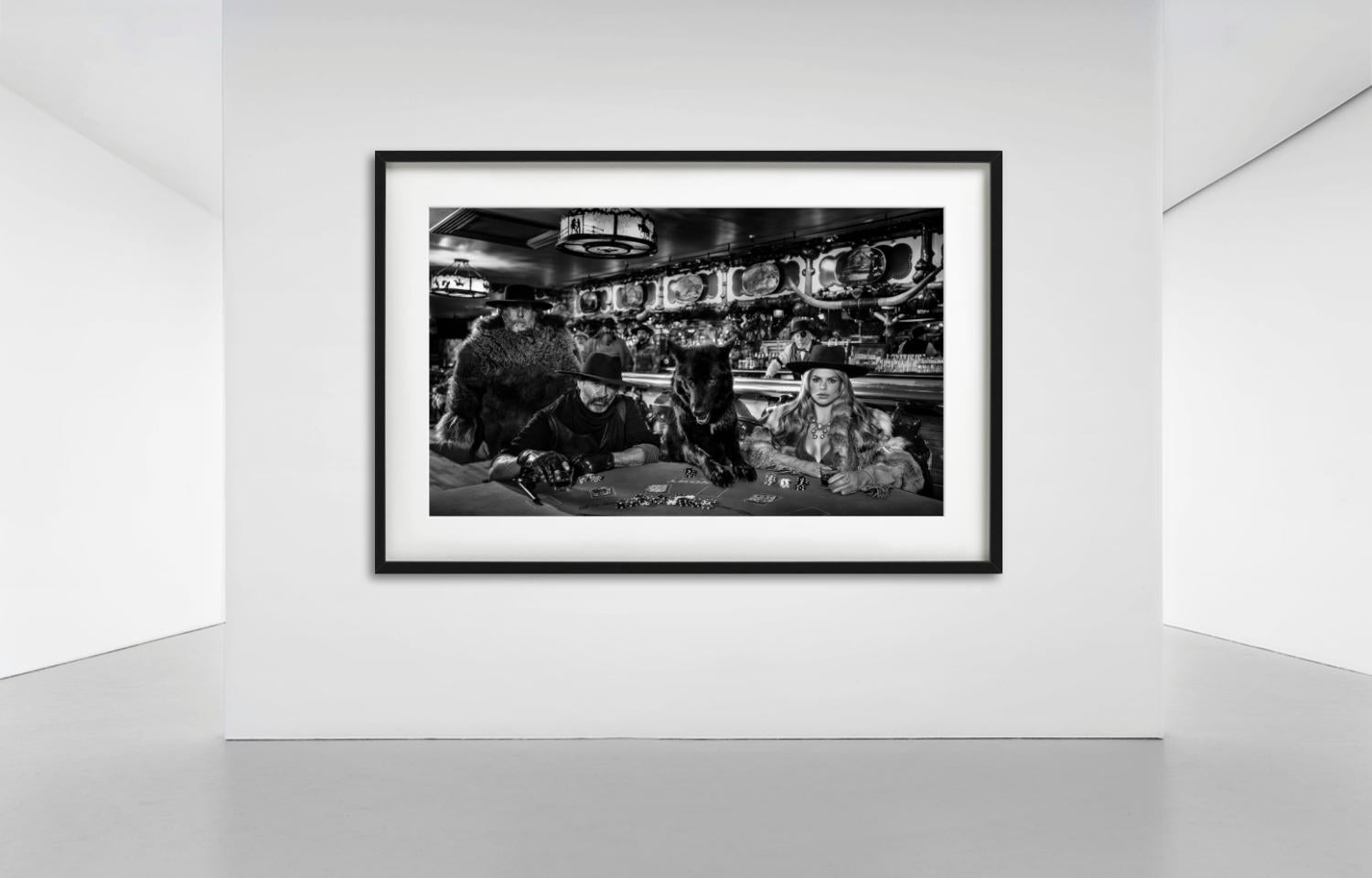 Poker Nights, Model with Cowboys and black Wolf playing cards in a Saloon, photographed by David Yarrow.

All prints are limited edition. Available in multiple sizes. High-end framing on request.

All prints are done and signed by the artist. The