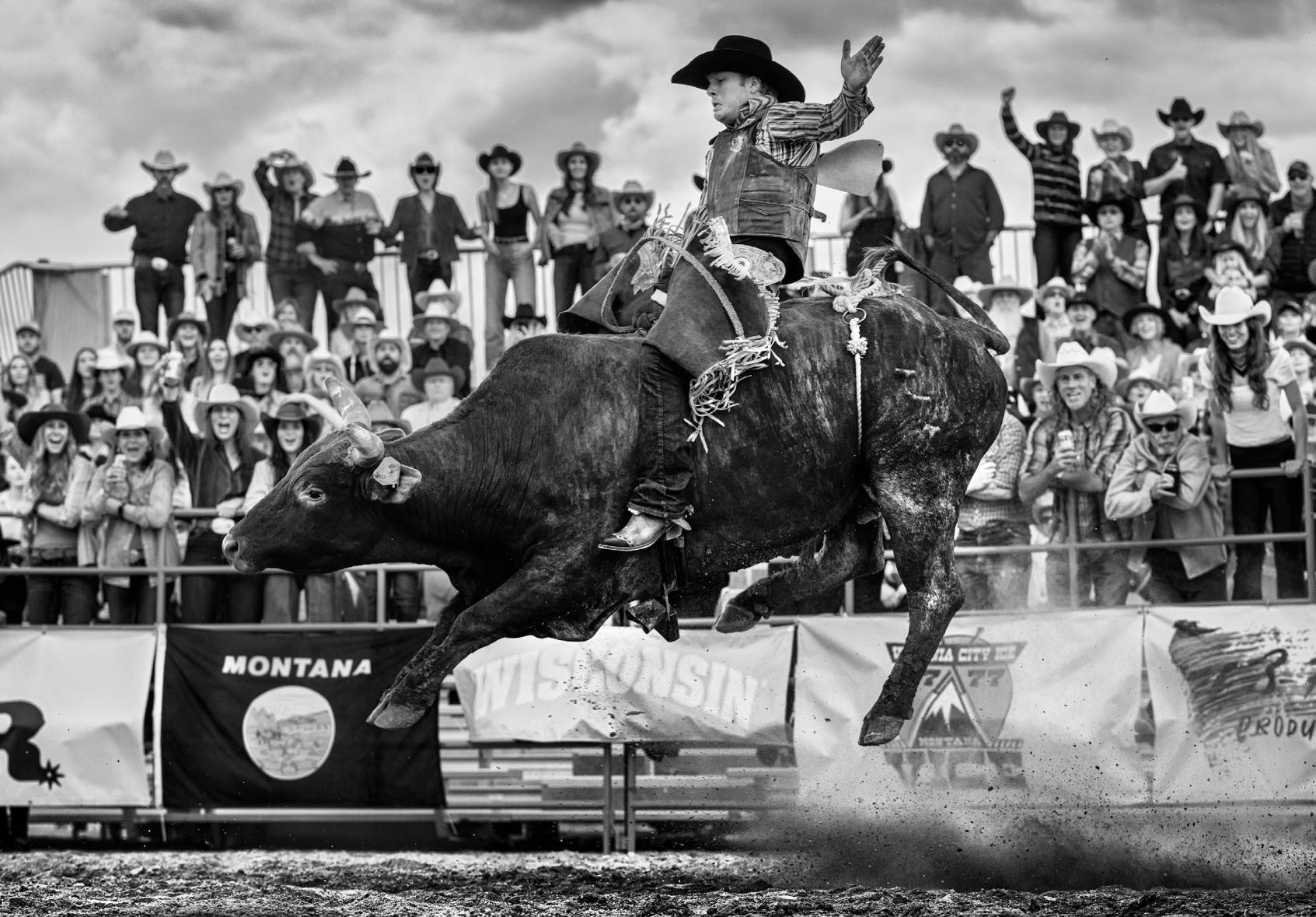 David Yarrow Black and White Photograph - 'Ride the Bull' - Rodeo Rider on the Bull, fine art photography, 2023
