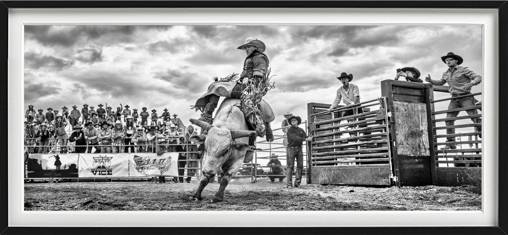 'Rodeo' - Cowboy on a Bull, fine art photography, 2023 - Photograph by David Yarrow