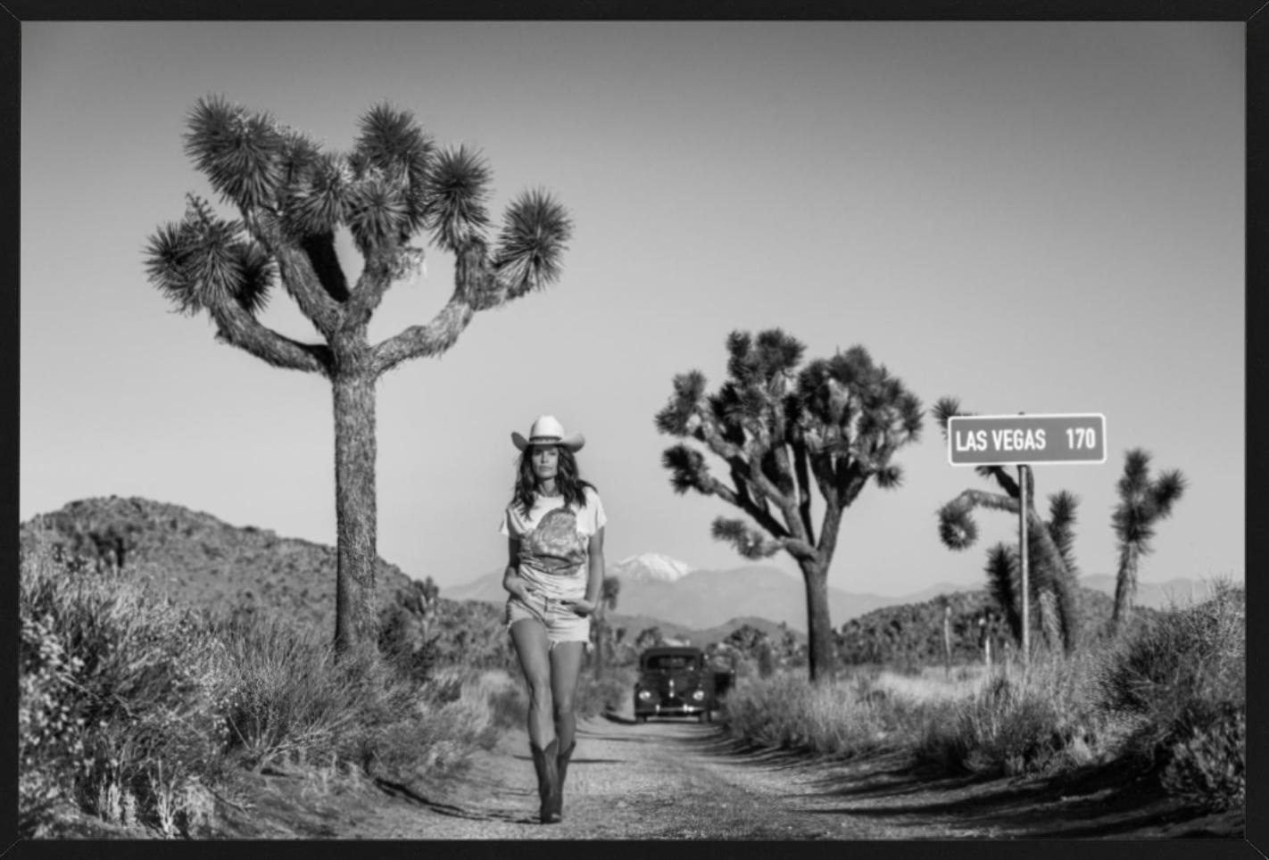 Sin City - Supermodel Cindy Crawford Walking in the desert, Joshua Tree - Contemporary Photograph by David Yarrow