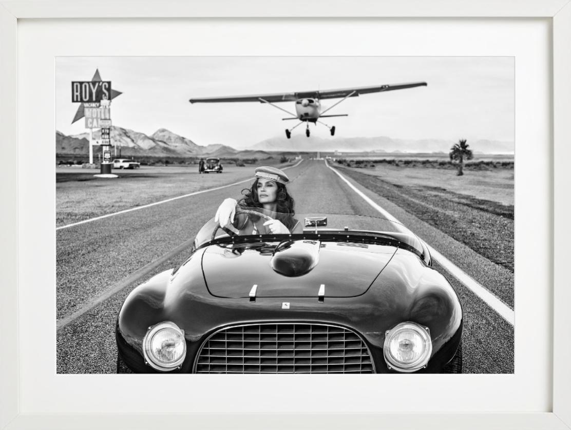 South by Southwest - Supermodel Cindy Crawford in vintage Ferrari on route 66 - Contemporary Photograph by David Yarrow