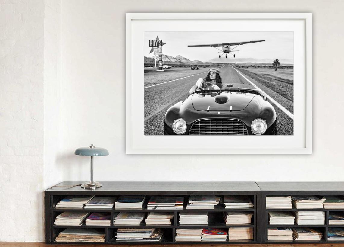 South by Southwest - Supermodel Cindy Crawford in vintage Ferrari on route 66 - Gray Black and White Photograph by David Yarrow