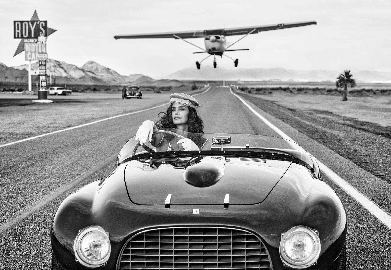 David Yarrow Black and White Photograph - South by Southwest - Supermodel Cindy Crawford in vintage Ferrari on route 66