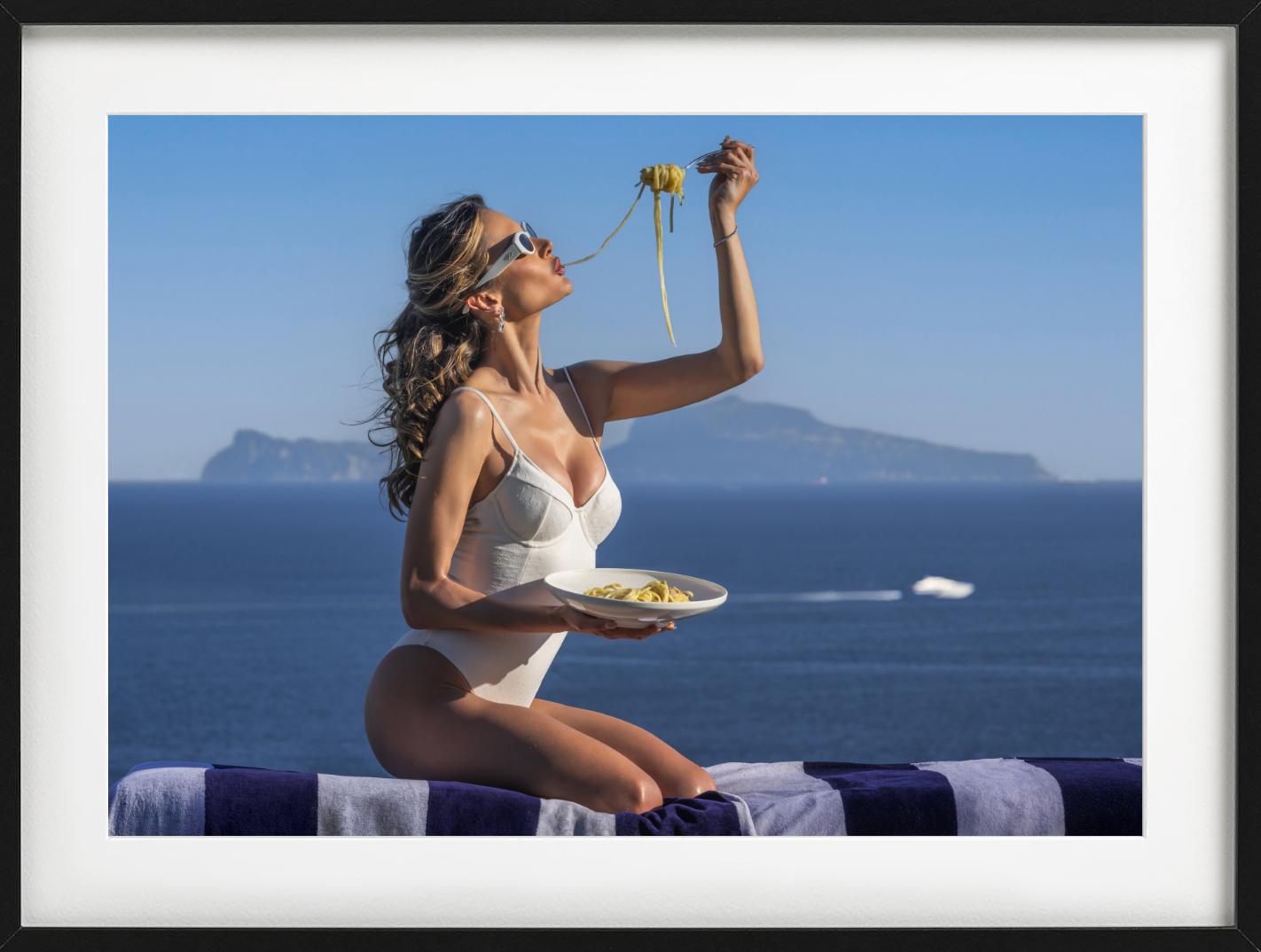 A woman eating spaghetti, photographed by David Yarrow. Available in black and white and color.  

All prints are limited edition. Available in multiple sizes. High-end framing on request.

All prints are done and signed by the artist. The collector