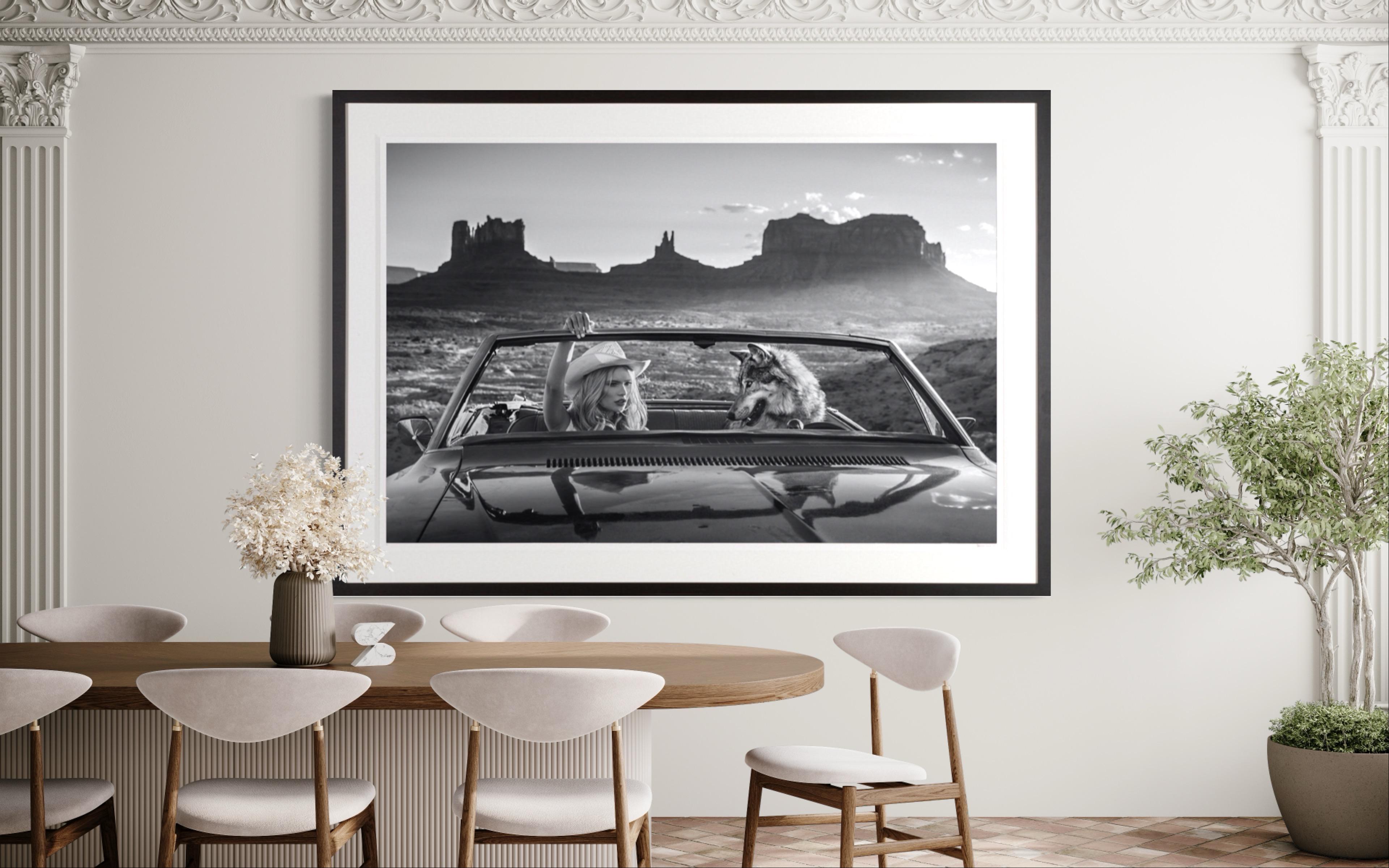 The Break Up / Josie Canseco and Wolf in a Vintage Car, Monument Vally Utah  - Photograph by David Yarrow