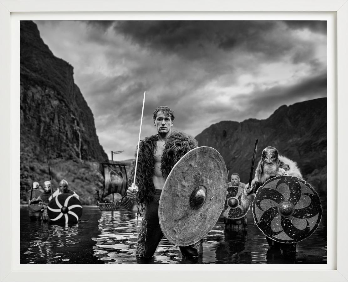 'The Viking' - Vikings standing in a Fjord, fine art photography, 2023 - Photograph by David Yarrow