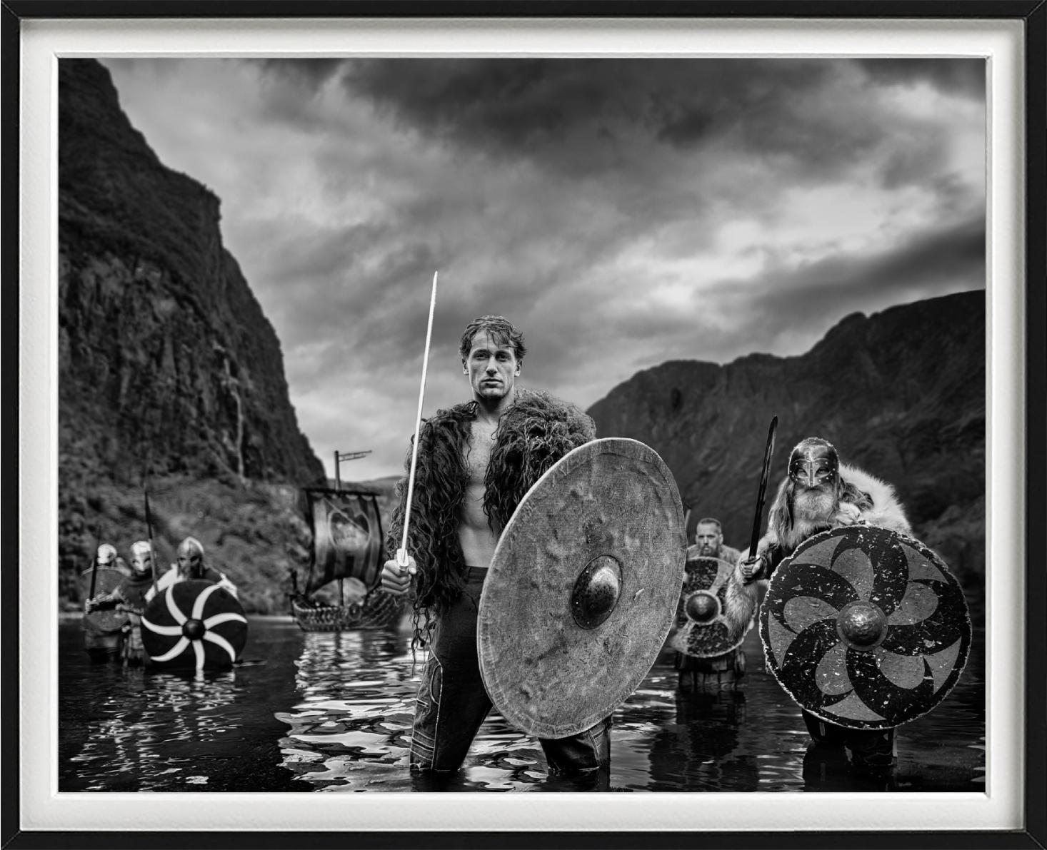 'The Viking' - Vikings standing in a Fjord, fine art photography, 2023 - Black Black and White Photograph by David Yarrow